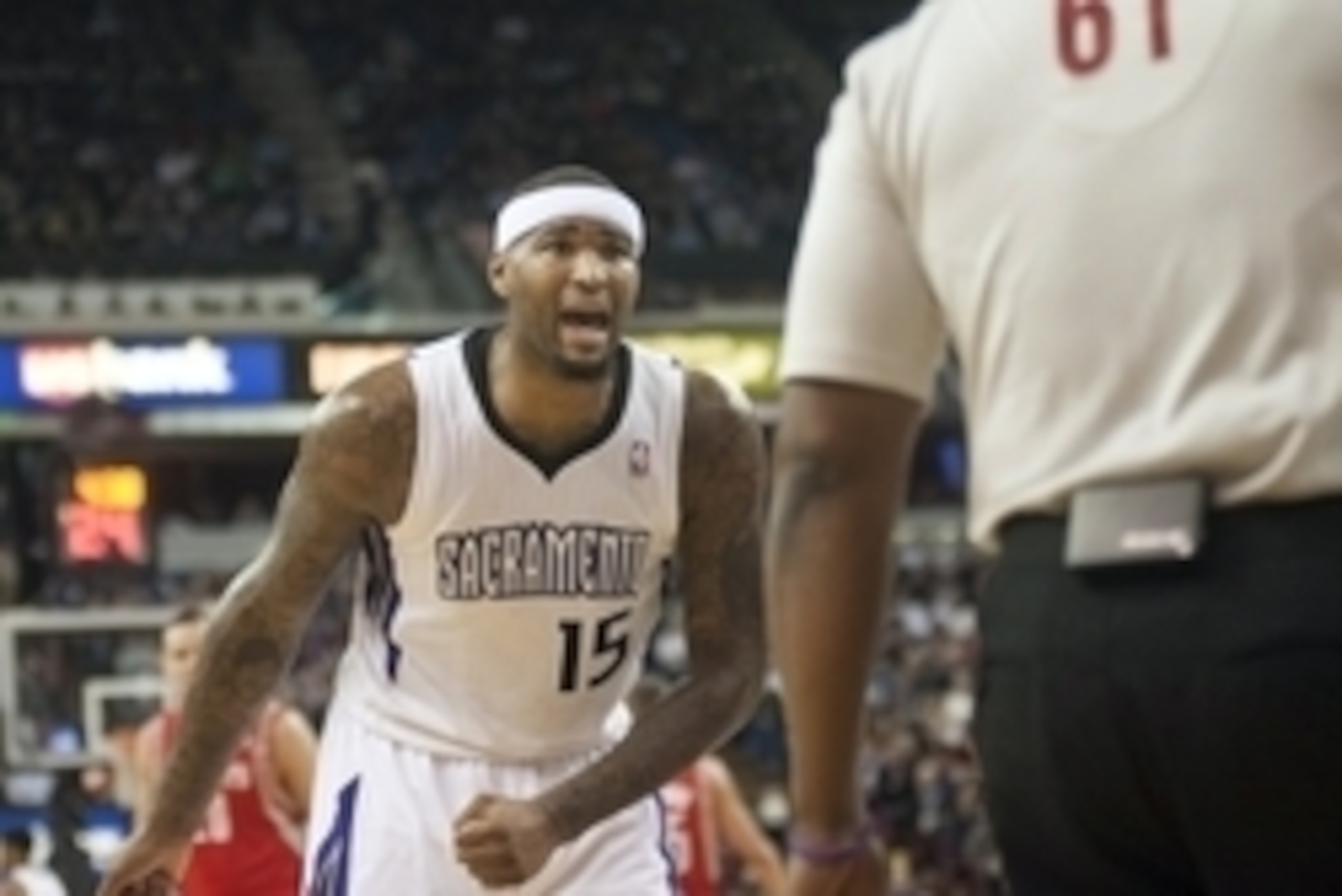 Feb 25, 2014; Sacramento, CA, USA; Sacramento Kings center DeMarcus Cousins (15) argues a call with referee Courtney Kirkland (61) during the first quarter at Sleep Train Arena. Mandatory Credit: Ed Szczepanski-USA TODAY Sports