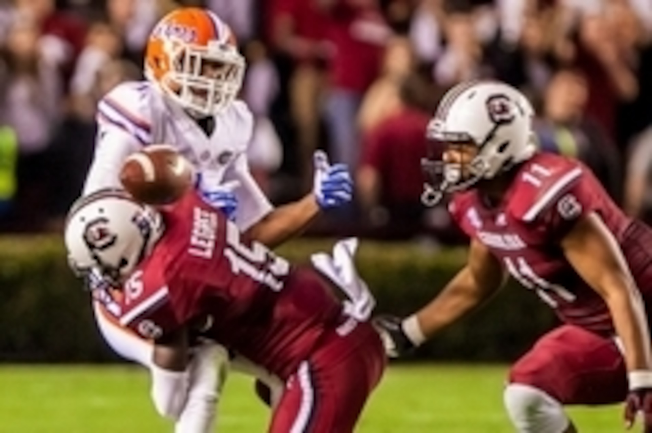 Nov 16, 2013; Columbia, SC, USA; South Carolina Gamecocks cornerback Jimmy Legree (15) breaks up a pass intended for Florida Gators wide receiver Quinton Dunbar (1) as South Carolina Gamecocks linebacker T.J. Holloman (11) closes in in the second half at 