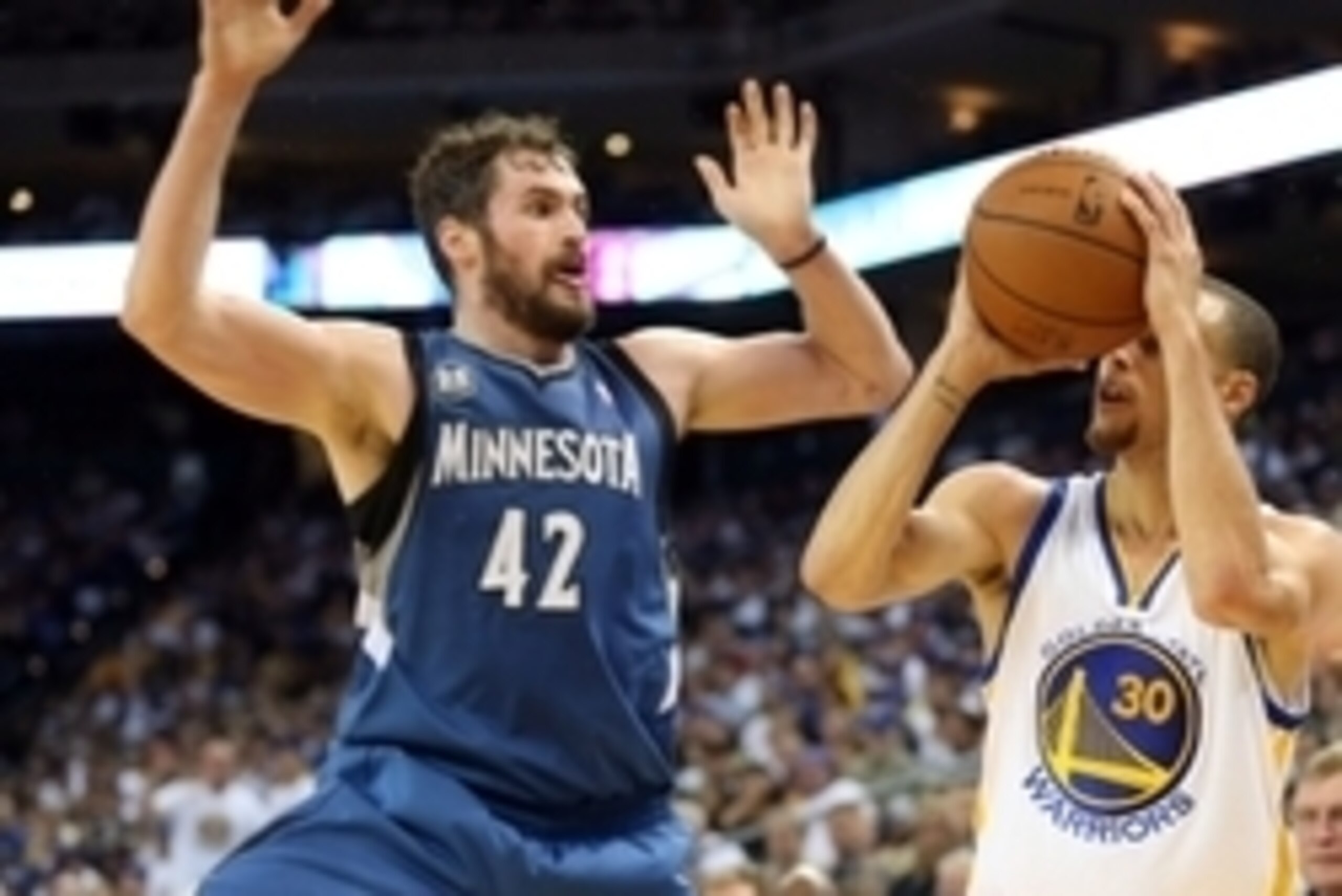 Apr 14, 2014; Oakland, CA, USA; Golden State Warriors guard Stephen Curry (30) shoots the ball against Minnesota Timberwolves forward Kevin Love (42) during the third quarter at Oracle Arena. The Golden State Warriors defeated the Minnesota Timberwolves 1
