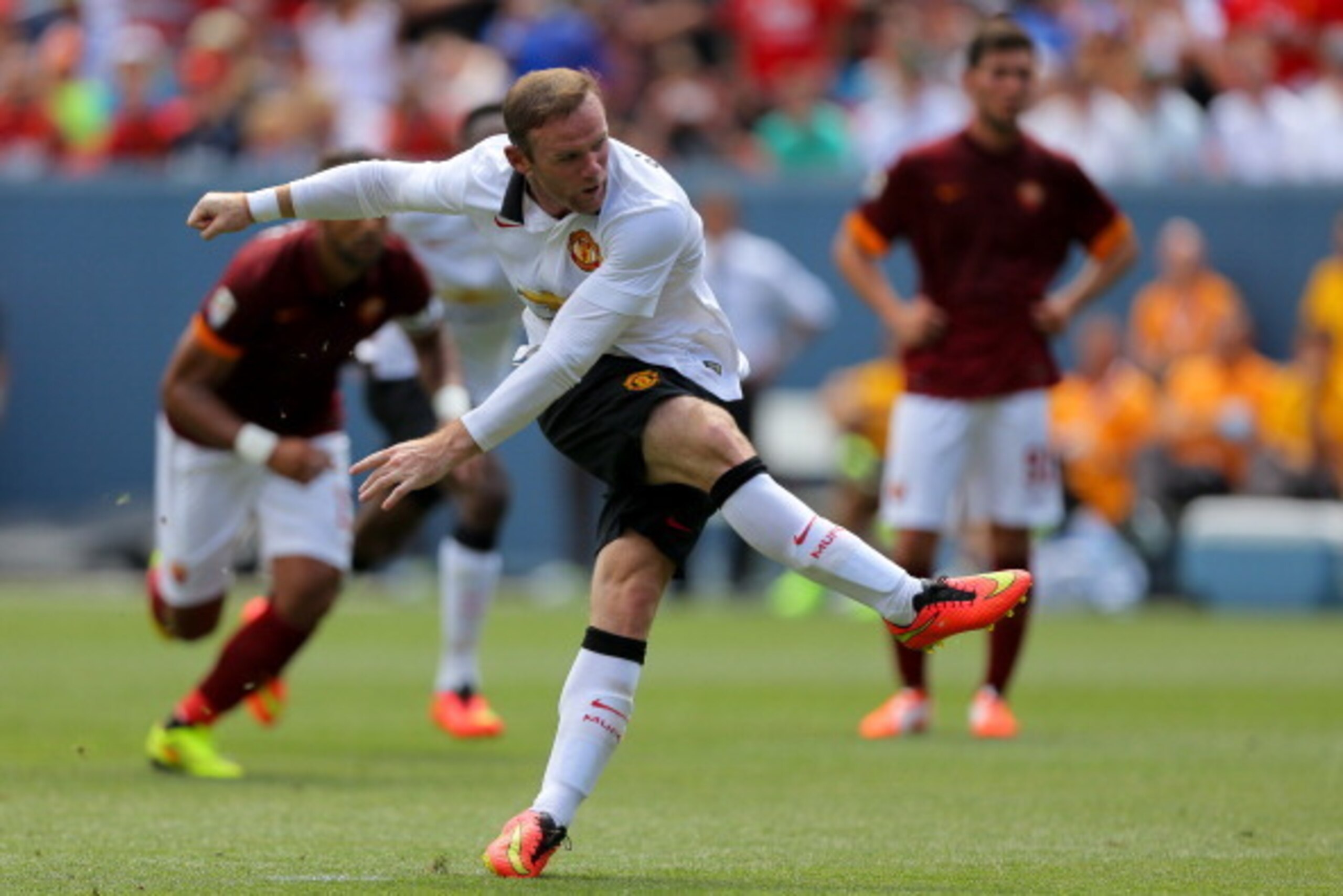 DENVER, CO - JULY 26: Wayne Rooney #10 of Manchester United follows through on a penalty goal during the first half of an International Champions Cup match against AS Roma at Sports Authority Field at Mile High on July 26, 2014 in Denver, Colorado. (Photo DENVER, CO - JULY 26: Wayne Rooney #10 of Manchester United follows through on a penalty goal during the first half of an International Champions Cup match against AS Roma at Sports Authority Field at Mile High on July 26, 2014 in Denver, Colorado. (Photo