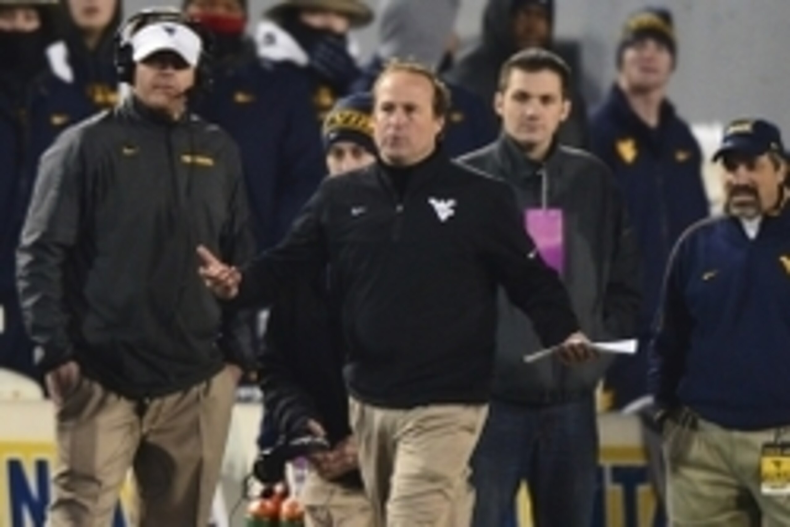 Nov 30, 2013; Morgantown, WV, USA; West Virginia Mountaineers head coach Dana Holgorsen reacts to a call made by the officials during the second quarter of the game against the Iowa State Cyclones at Milan Puskar Stadium. Mandatory Credit: Tommy Gilligan-