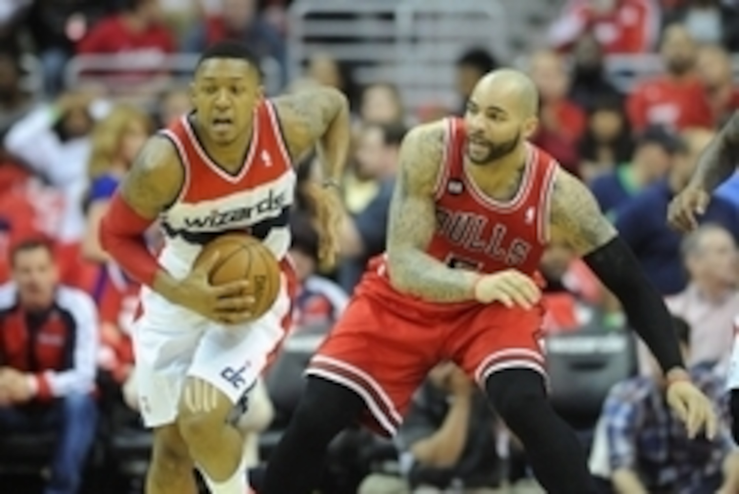 Apr 27, 2014; Washington, DC, USA; Washington Wizards shooting guard Bradley Beal (3) leads a fast break as Chicago Bulls power forward Carlos Boozer (5) looks on during the first quarter in game four of the first round of the 2014 NBA Playoffs at Verizon