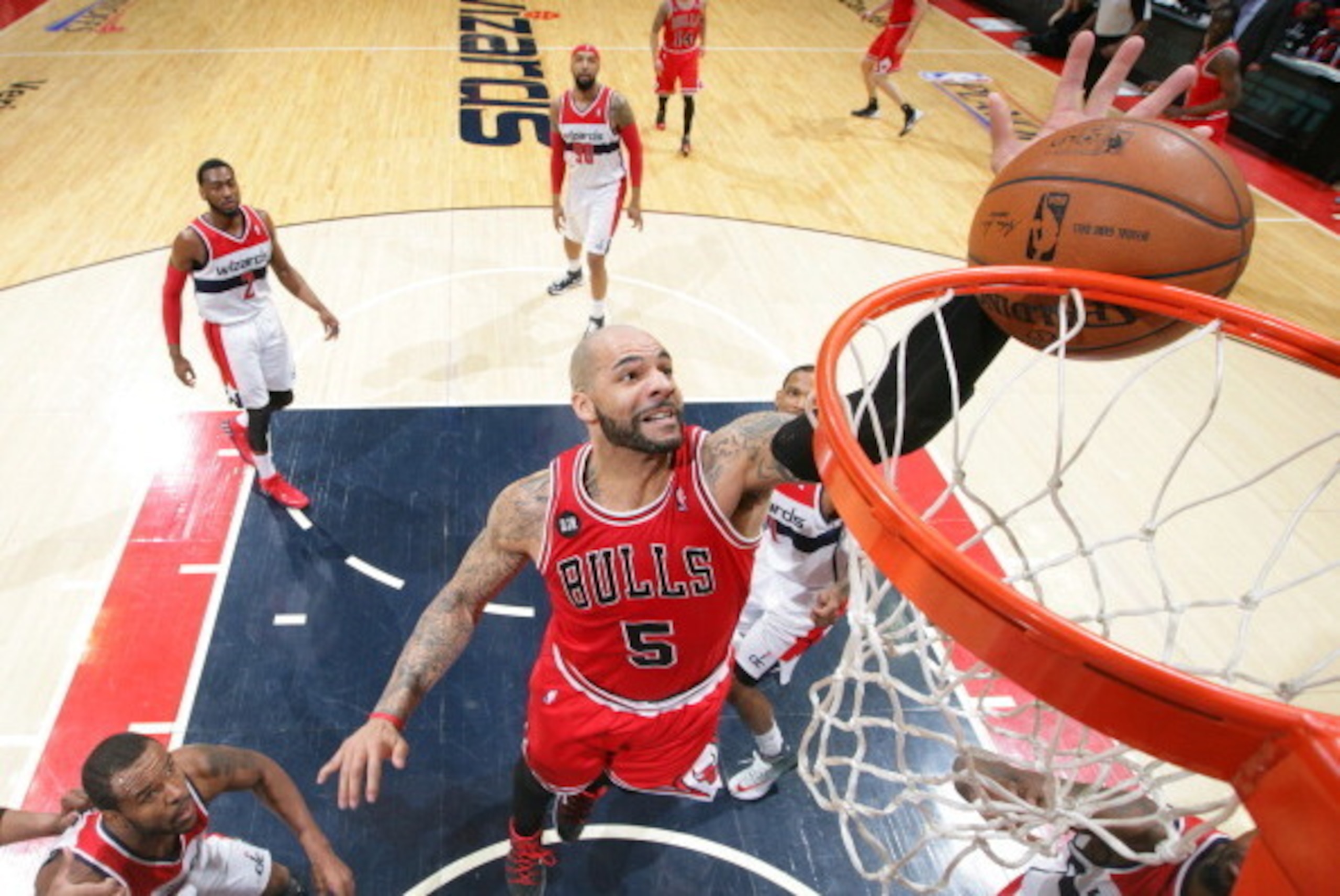 WASHINGTON, DC - APRIL 27: Carlos Boozer #5 of the Chicago Bulls grabs a rebound against the Washington Wizards in Game Four of the Eastern Conference Quarterfinals during the 2014 NBA Playoffs at the Verizon Center on April 27, 2014 in Washington, DC. NO WASHINGTON, DC - APRIL 27: Carlos Boozer #5 of the Chicago Bulls grabs a rebound against the Washington Wizards in Game Four of the Eastern Conference Quarterfinals during the 2014 NBA Playoffs at the Verizon Center on April 27, 2014 in Washington, DC. NO