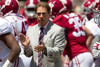 Apr 19, 2014; Tuscaloosa, AL, USA;  Alabama Crimson Tide head coach Nick Saban brings the team on to the field prior to the A-Day game at Bryant-Denny Stadium. Mandatory Credit: Marvin Gentry-USA TODAY Sports