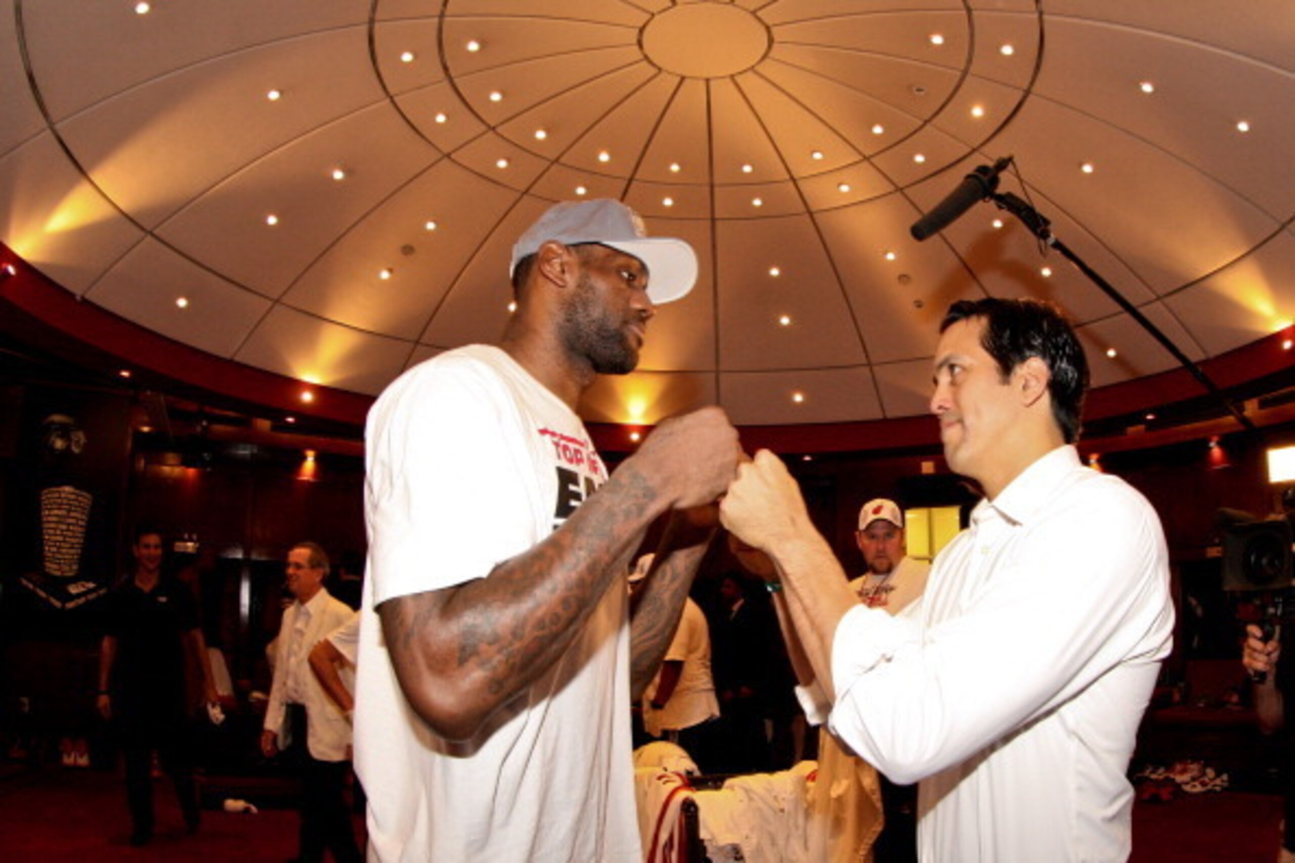 MIAMI, FL - JUNE 3: Head Coach Erik Spoelstra of the Miami Heat celebrates with LeBron James #6 in the locker room following their team's series victory against the Indiana Pacers in Game Seven of the Eastern Conference Finals during the 2013 NBA Playoffs