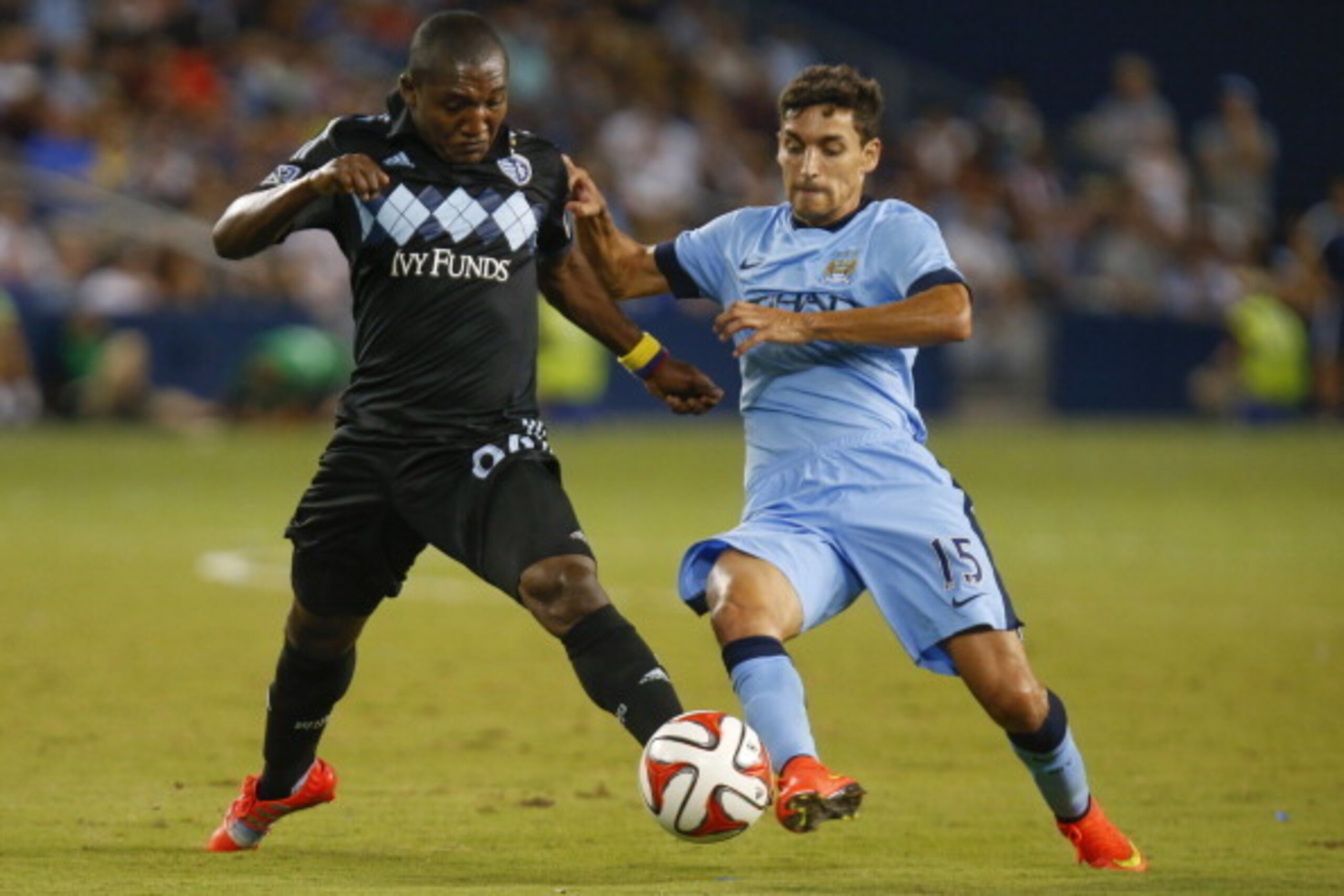 KANSAS CITY, KS - JULY 23: Jimmy Medranda #94 of SportingKC deflects the ball away from Jesus Navas #15 of Manchester City midway in the second half on July 23rd at Sporting Park in Kansas City, Kansas. (Photo by Kyle Rivas/Getty Images)