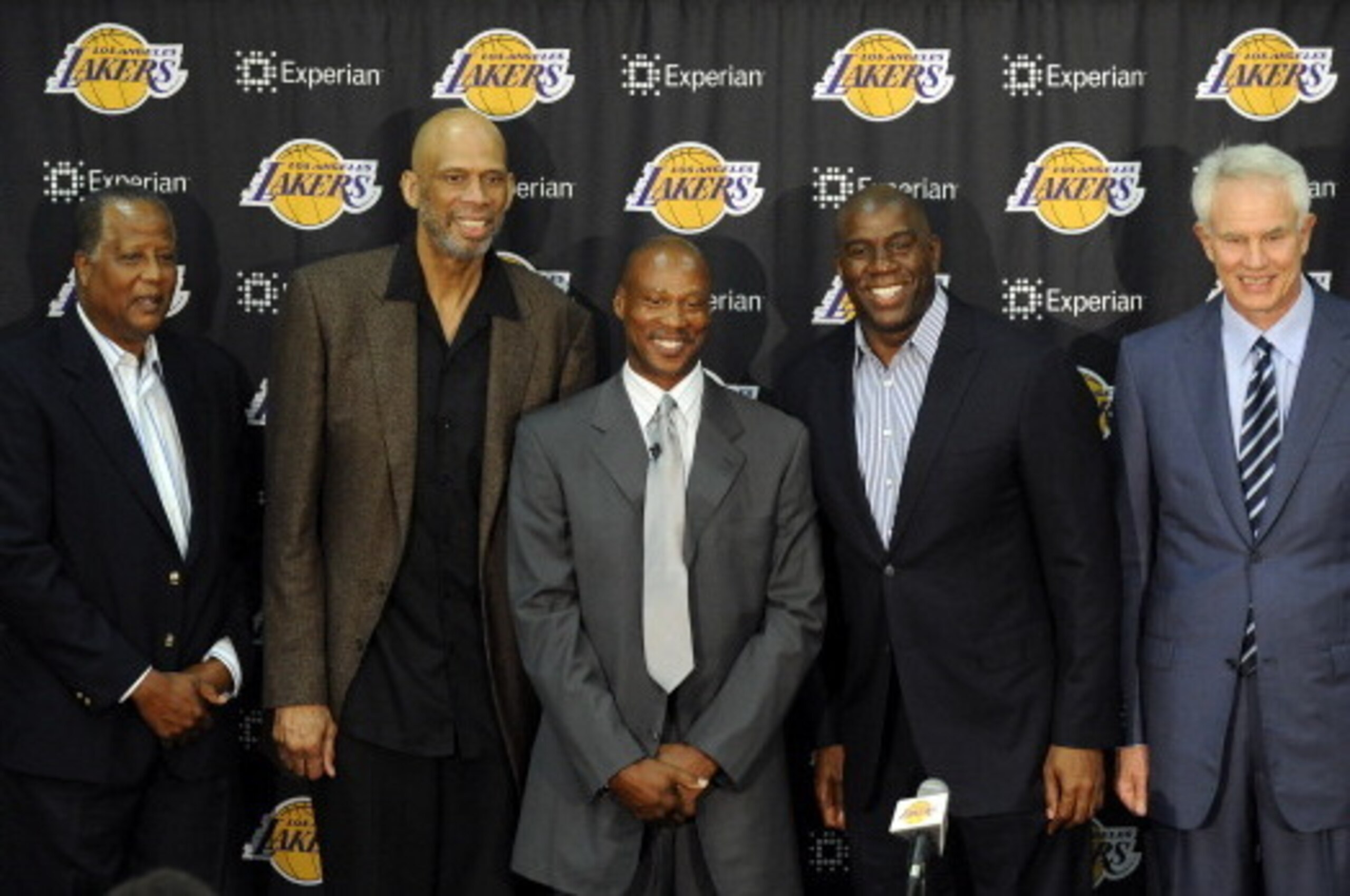 EL SEGUNDO, CA - JULY 29:   (L-R) Jamaal Wilkes, Kareem Abdul-Jabbar, Byron Scott, Earvin 'Magic' Johnson and Mitch Kupchak pose for a picture during a press conference to introduce Byron Scott as the new head coach of the Los Angeles Lakers on July 29, 2