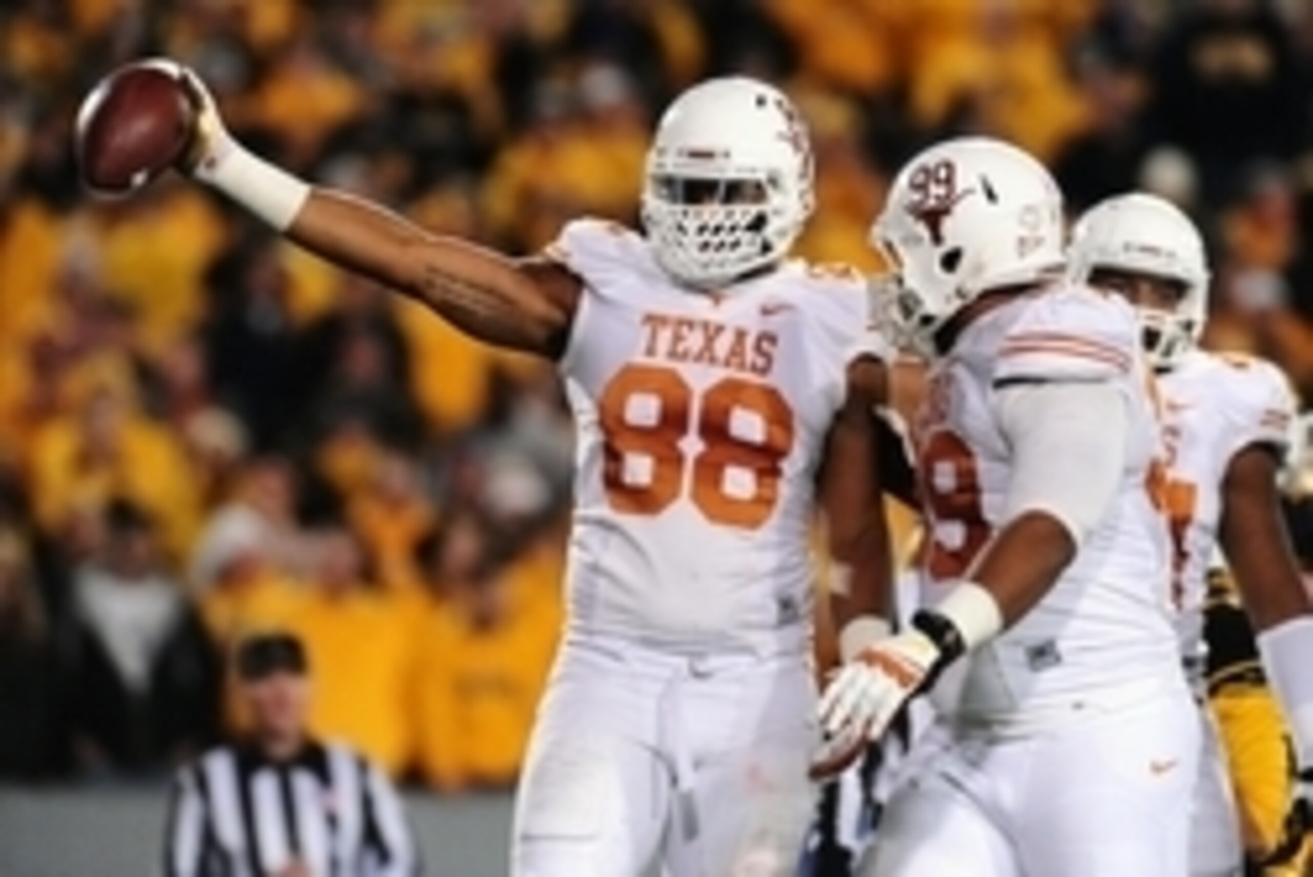 Nov 9, 2013; Morgantown, WV, USA; Texas Longhorns defensive end Cedric Reed (88) reacts after recovering a fumble in the second quarter against the West Virginia Mountaineers at Milan Puskar Stadium. Mandatory Credit: Evan Habeeb-USA TODAY Sports