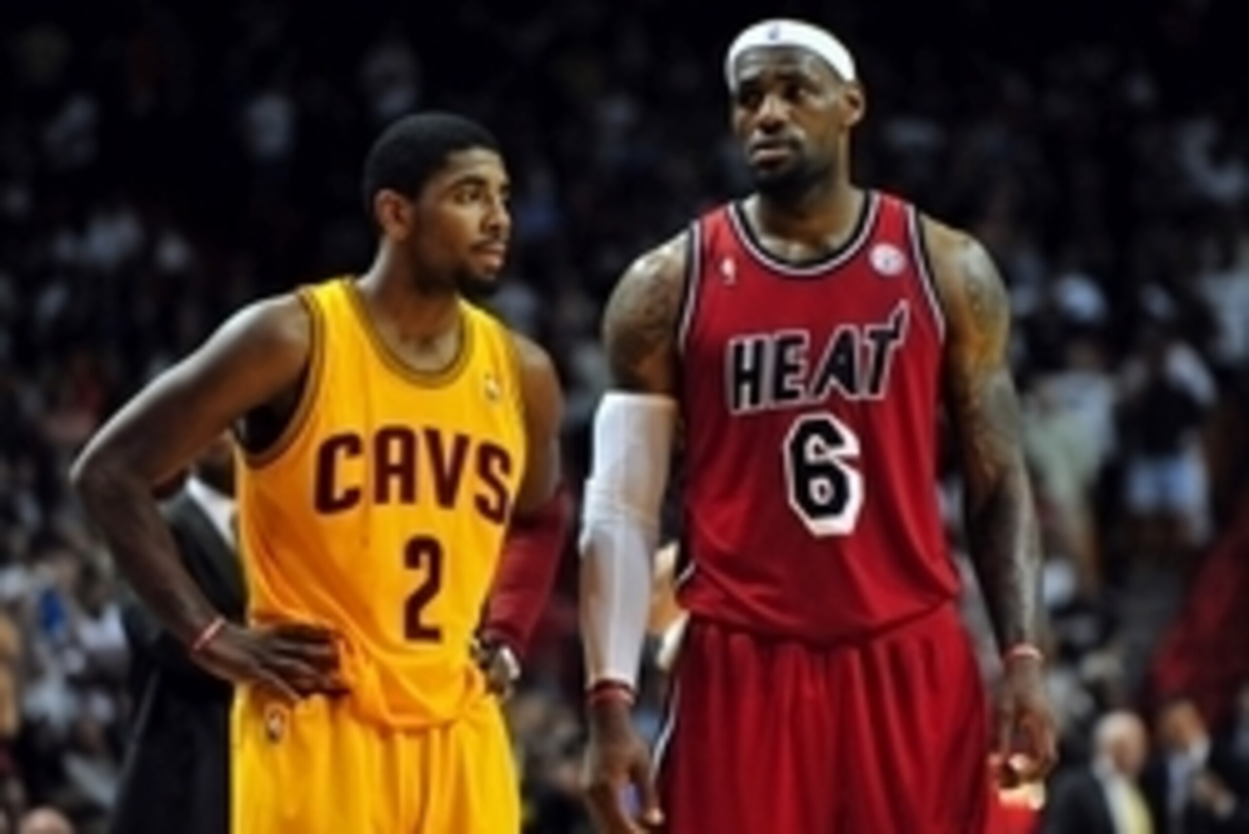 Feb 24, 2013; Miami, FL, USA; Cleveland Cavaliers point guard Kyrie Irving (2) and Miami Heat small forward LeBron James (6) during the second half at the American Airlines Arena.  MIami won 109-105. Mandatory Credit: Steve Mitchell-USA TODAY Sports