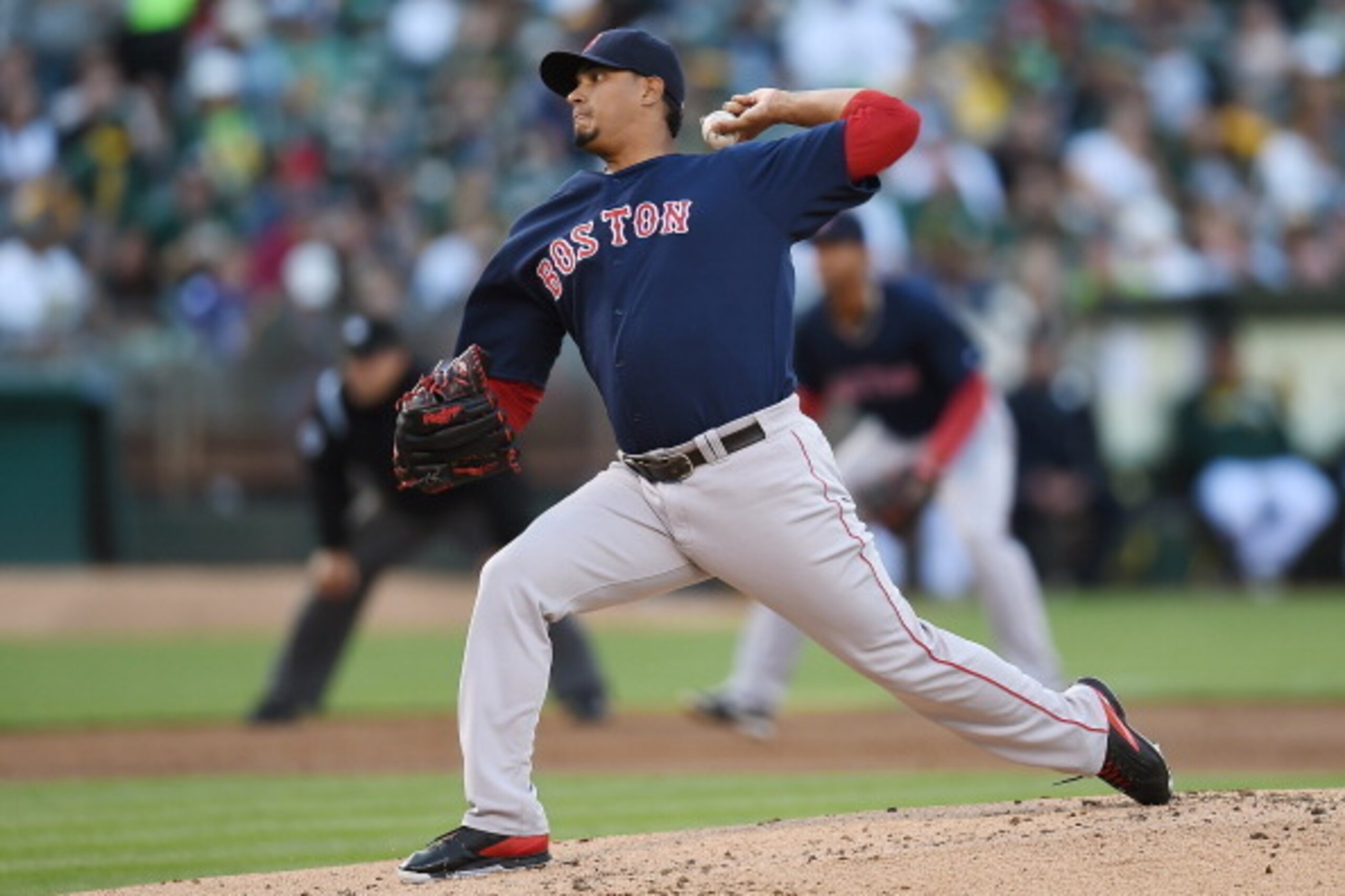 OAKLAND, CA - JUNE 20:  Felix Doubront #22 of the Boston Red Sox pitches in the bottom of the first inning against the Oakland Athletics at O.co Coliseum on June 20, 2014 in Oakland, California.  (Photo by Thearon W. Henderson/Getty Images)