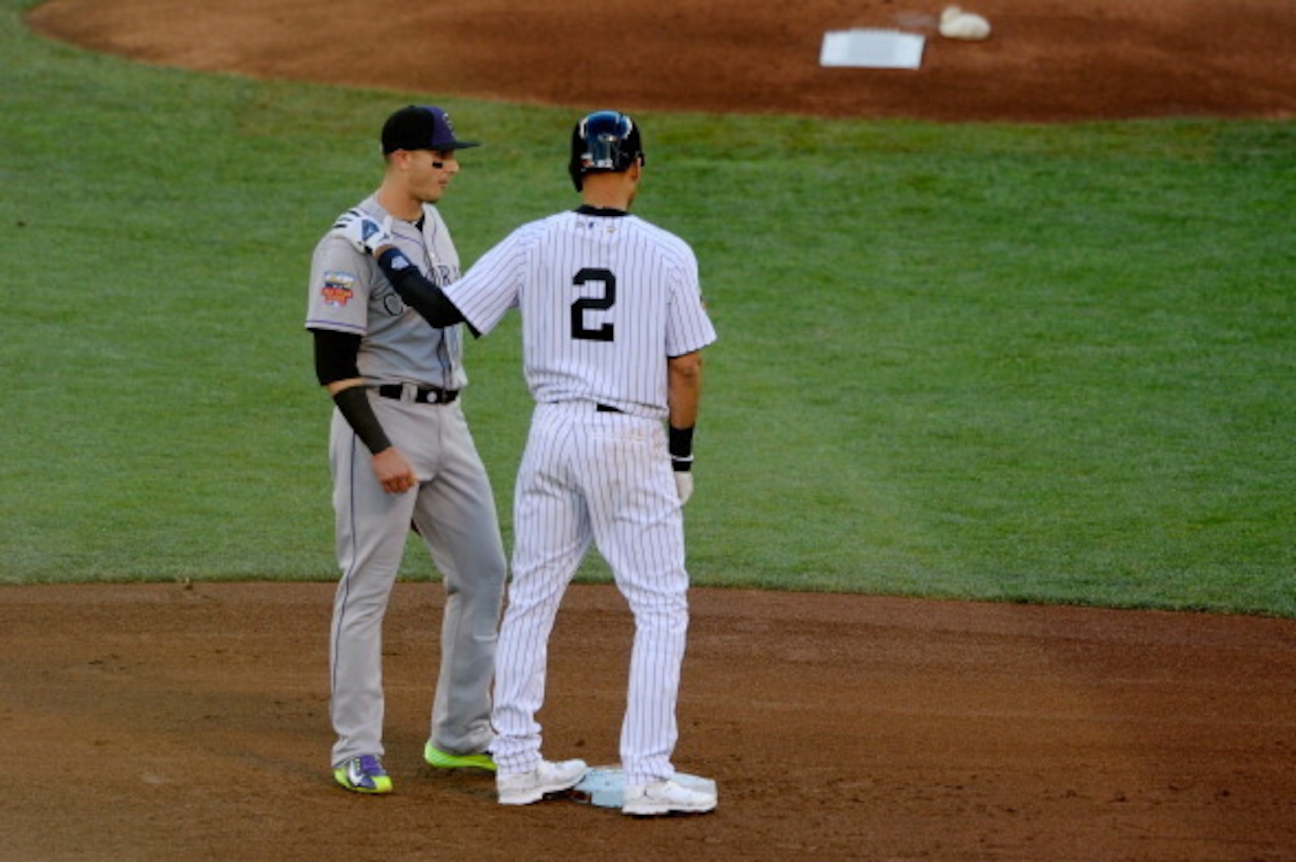 MINNEAPOLIS, MN - JULY 15:  American League All-Star Derek Jeter #2 of the New York Yankees speaks with National League All-Star Troy Tulowitzki #2 of the Colorado Rockies during the 85th MLB All-Star Game at Target Field on July 15, 2014 in Minneapolis, 