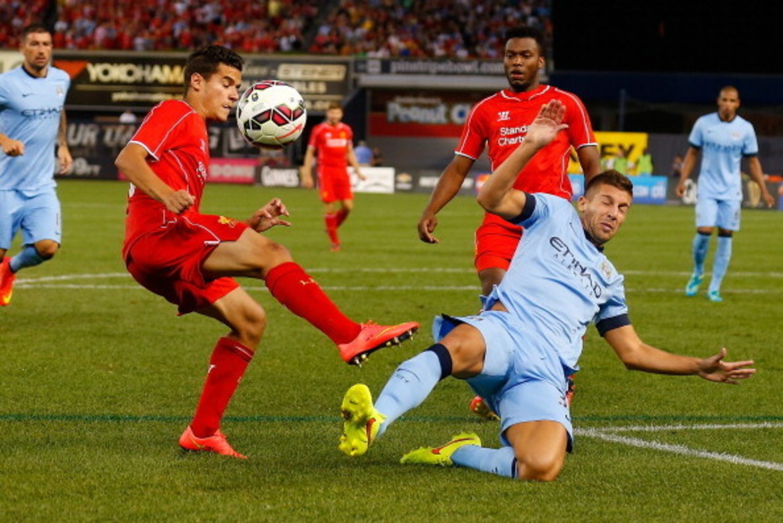 NEW YORK, NY - JULY 30:  Matija Nastasic #33 of Manchester City and Philippe Coutinho #10 of Liverpool vie for the ball during the International Champions Cup 2014 at Yankee Stadium on July 30, 2014 in the Bronx borough of New York City.  (Photo by Mike S