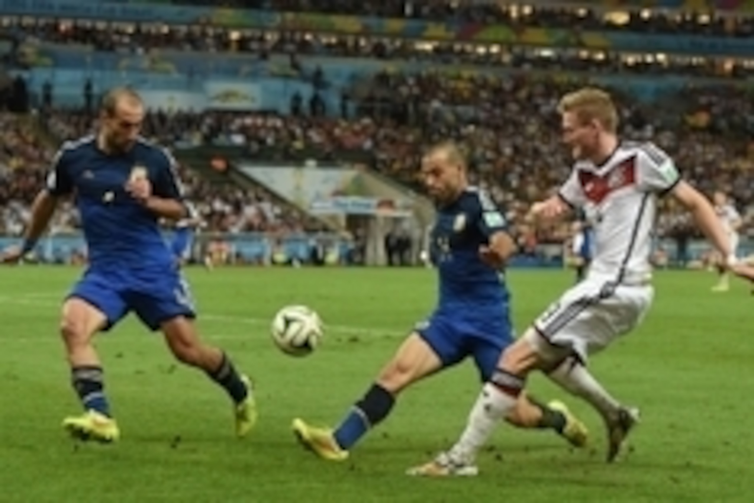 July 13, 2014; Rio de Janeiro, BRAZIL; Germany midfielder Andre Schurrle (9) crosses the ball for a goal by Germany midfielder Mario Gotze (not pictured) against Argentina defender Javier Mascherano (14) in the championship match of the 2014 World Cup at 