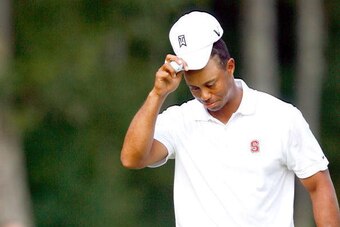 NORTON, MA - SEPTEMBER 05:  Tiger Woods tips his hat during the second round of the Deutsche Bank Championship held at TPC Boston on September 5, 2009 in Norton, Massachusetts.  (Photo by Jim Rogash/Getty Images)