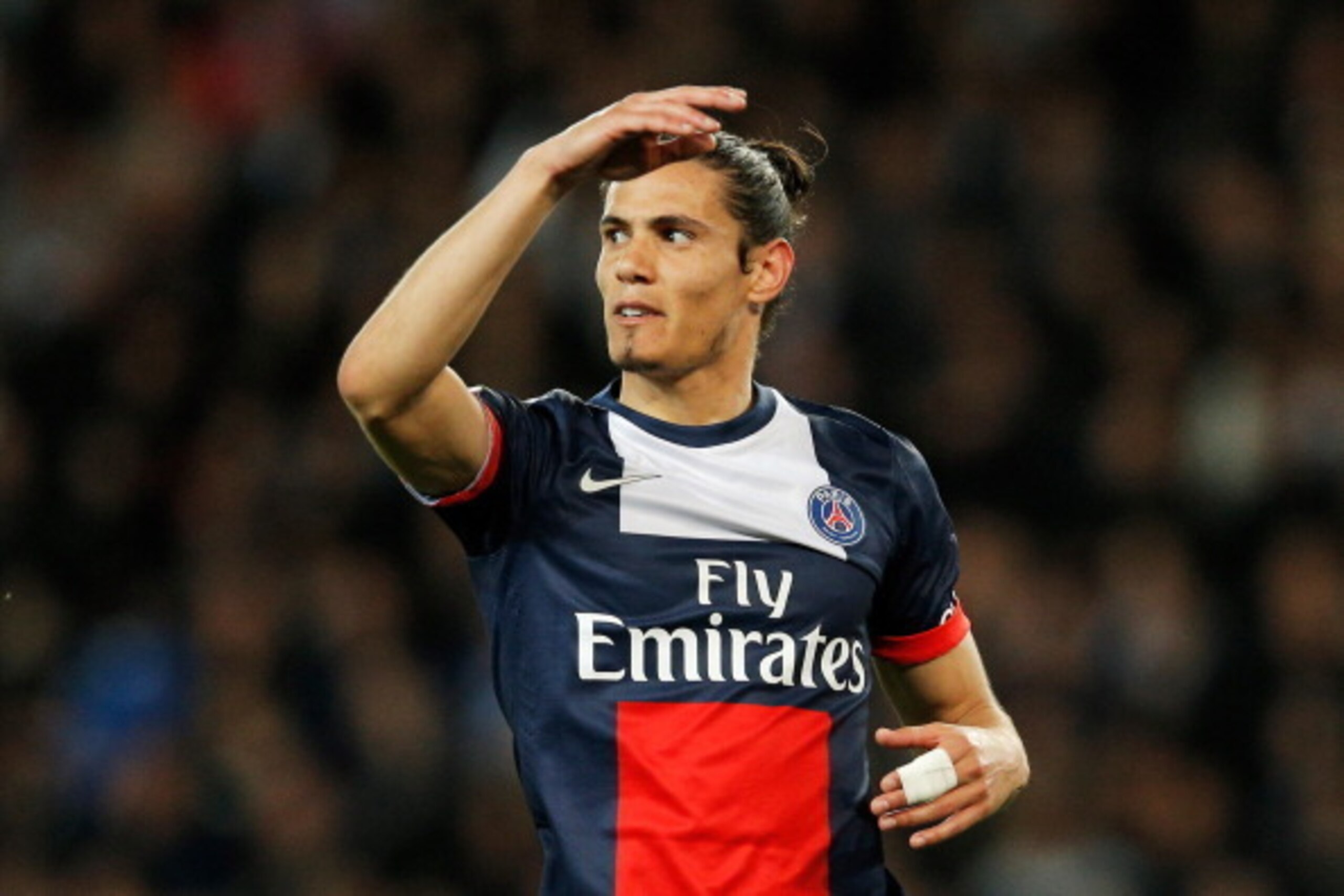 PARIS, FRANCE - MAY 07:  Edinson Cavani of PSG reacts to a missed chance on goal during the Ligue 1 match between Paris Saint-Germain FC and Stade Rennais FC at Parc des Princes on May 7, 2014 in Paris, France.  (Photo by Dean Mouhtaropoulos/Getty Images)
