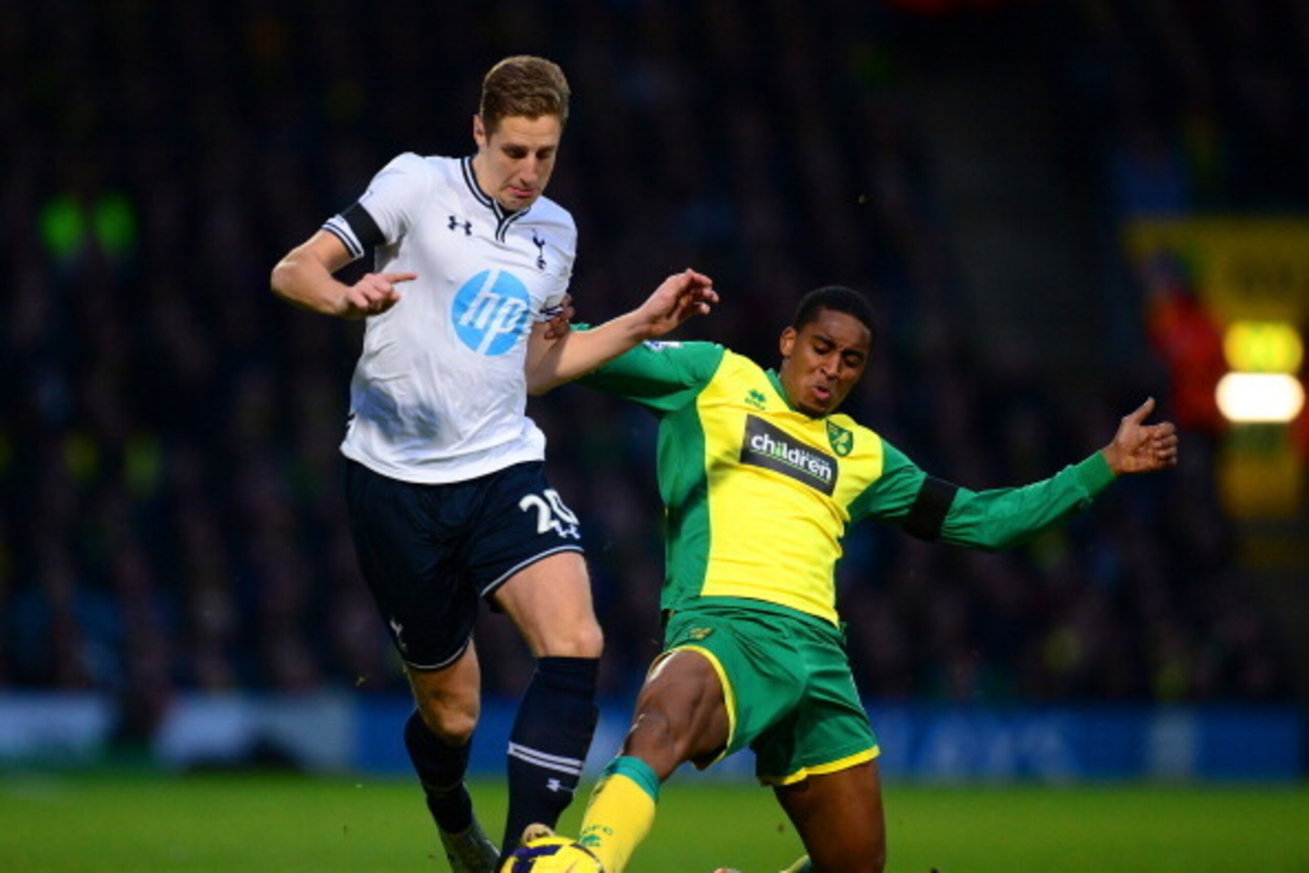 NORWICH, ENGLAND - FEBRUARY 23: Leroy Fer of Norwich City tackles Michael Dawson of Tottenham Hotspur  during the Barclays Premier League match between Norwich City and Tottenham Hotspur at Carrow Road on February 23, 2014 in Norwich, England.  (Photo by 