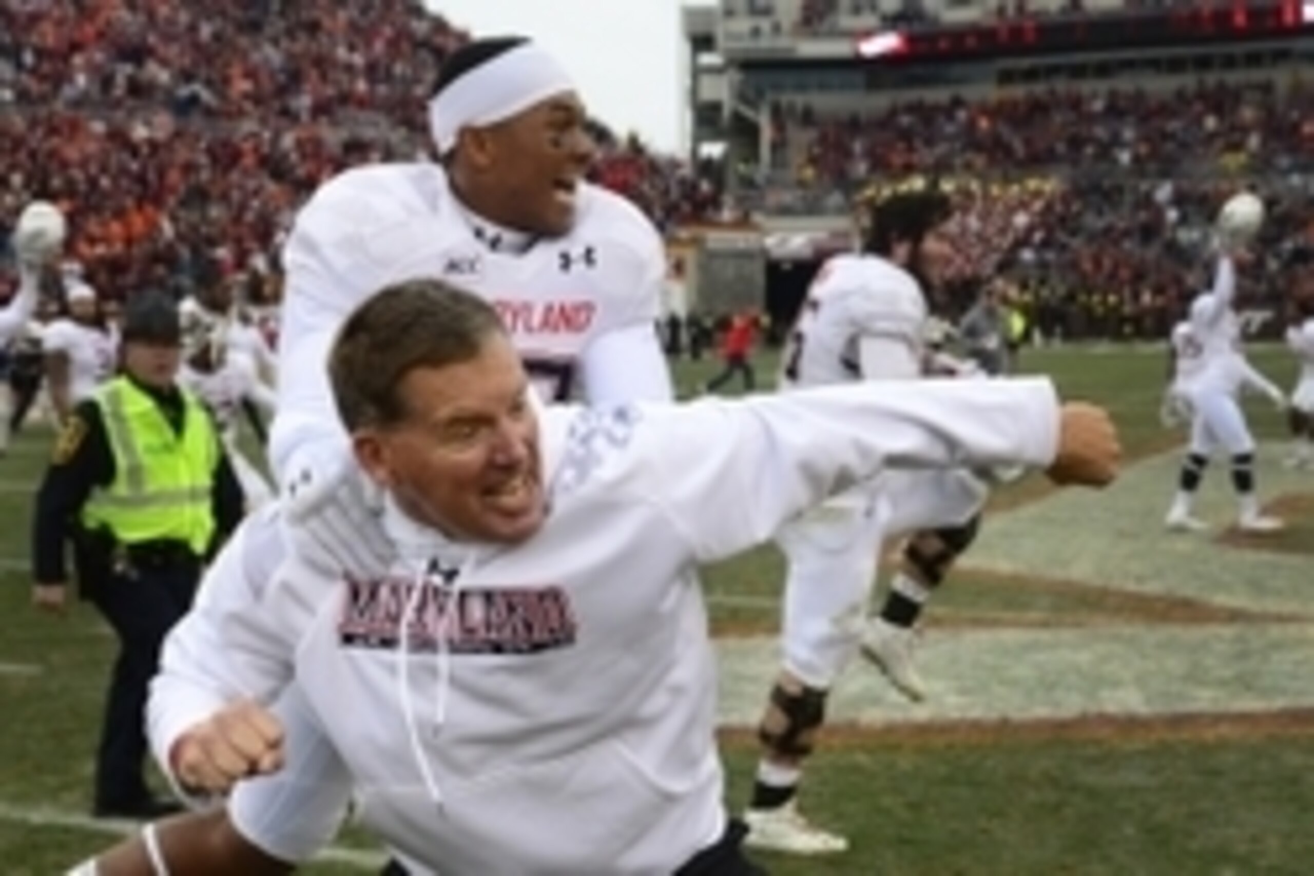 Nov 16, 2013; Blacksburg, VA, USA; Maryland Terrapins head coach Randy Edsall reacts with linebacker Jermaine Carter Jr. (23) after the the Terapins defeated the Virginia Tech Hokies 27-24 in overtime at Lane Stadium. Mandatory Credit: Bob Donnan-USA TODA