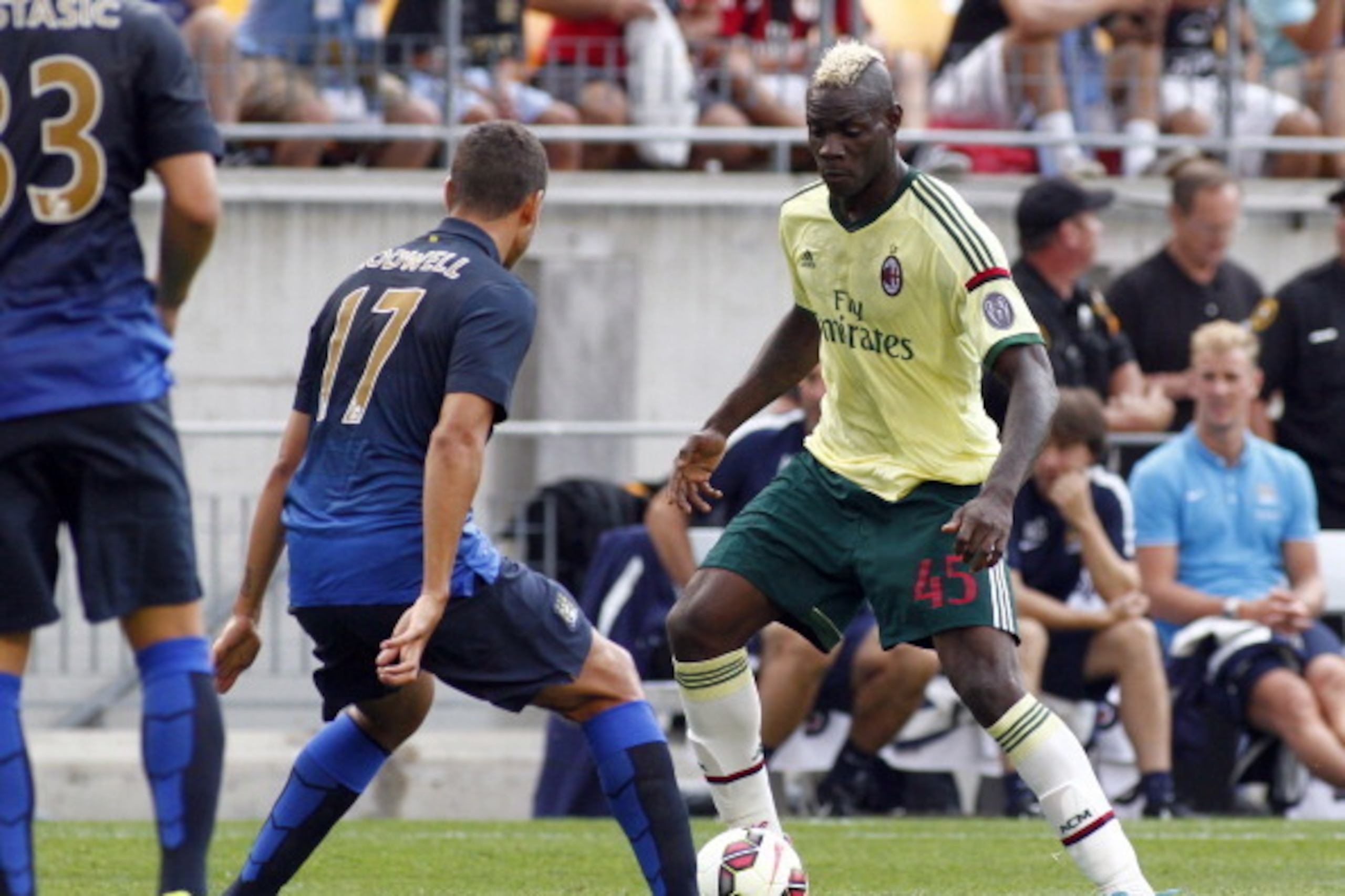 PITTSBURGH, PA - JULY 27:  Mario Balotelli #45 of AC Milan handles the ball against Jack Rodwell #17 of Manchester City during International Champions Cup 2014 at Heinz Field on July 27, 2014 in Pittsburgh, Pennsylvania.  (Photo by Justin K. Aller/Getty I