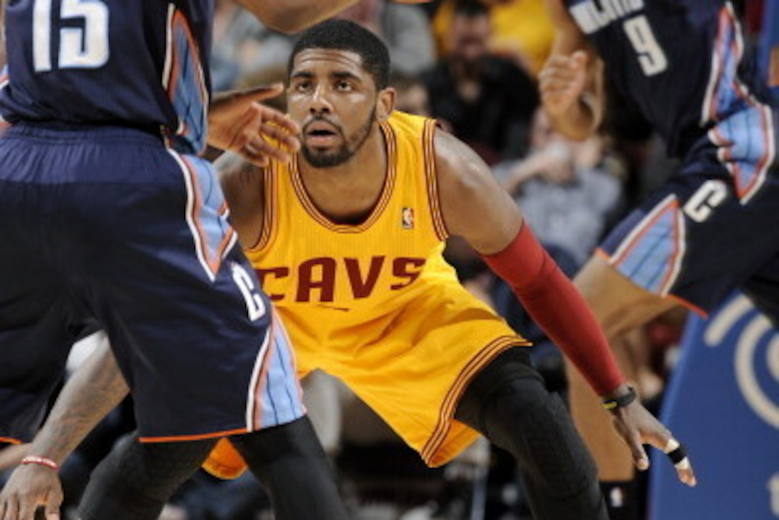 CLEVELAND, OH - APRIL 5:  Kyrie Irving #2 of the Cleveland Cavaliers defends his position against Kemba Walker #15 of the Charlotte Bobcats at The Quicken Loans Arena on April 5, 2014 in Cleveland, Ohio. NOTE TO USER: User expressly acknowledges and agree