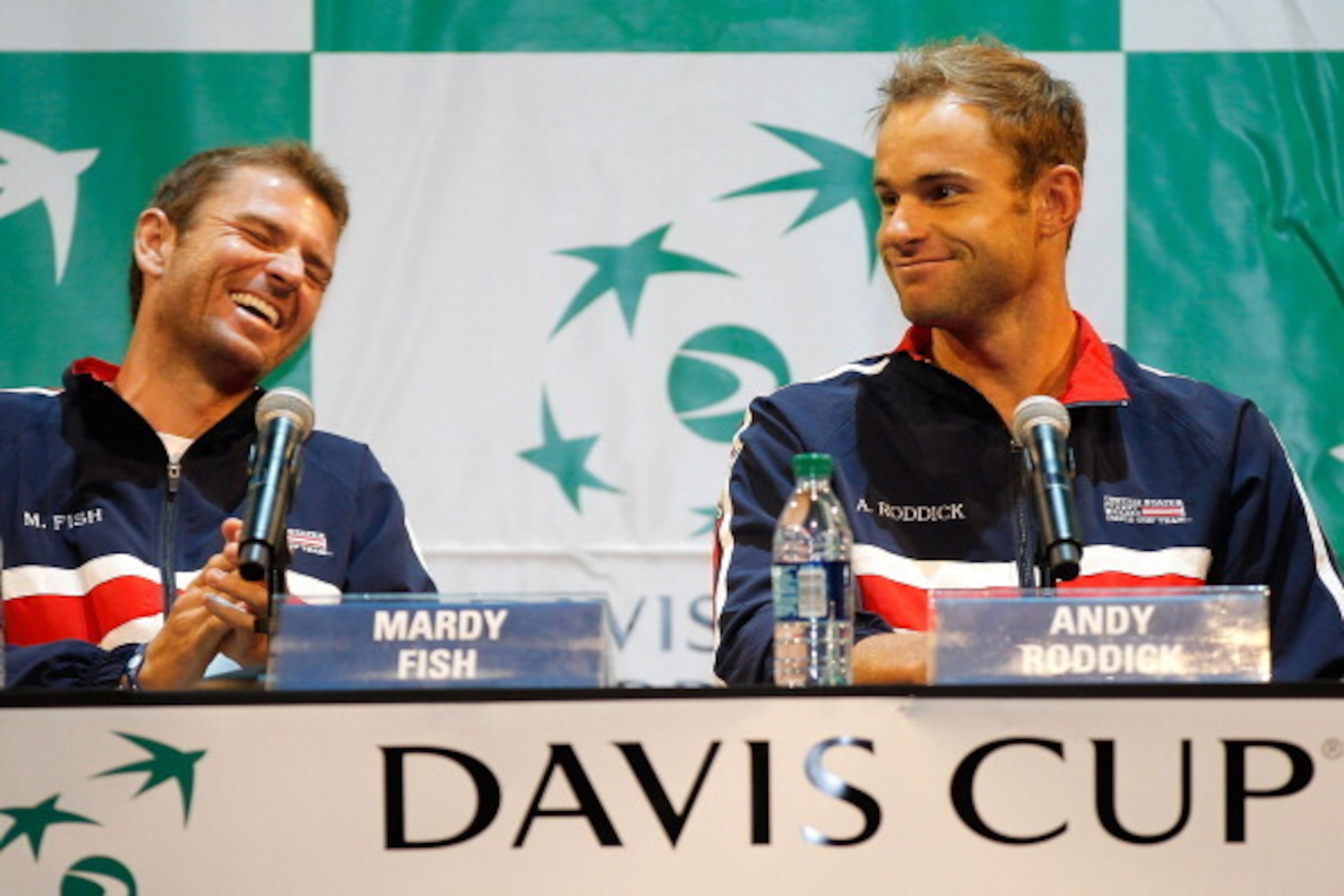 AUSTIN, TX - JULY 07:  Flanked by US Davis Cup teammate Mardy Fish, Andy Roddick fields  questions from the media after the draw ceremony for their tie against Spain held at The Moody Theatre on July 7, 2011 in Austin, Texas.  (Photo by Matthew Stockman/G