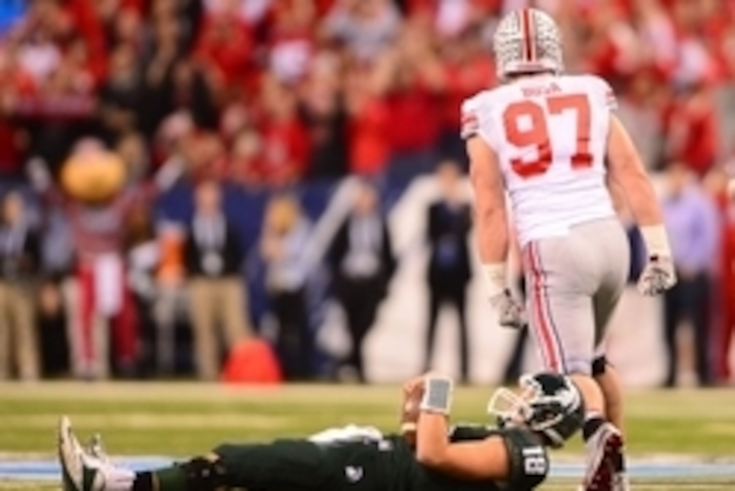 Dec 7, 2013; Indianapolis, IN, USA; Ohio State Buckeyes defensive lineman Joey Bosa (97) reacts after sacking Michigan State Spartans quarterback Connor Cook (18) during the first quarter of the 2013 Big 10 Championship game at Lucas Oil Stadium. Mandator Dec 7, 2013; Indianapolis, IN, USA; Ohio State Buckeyes defensive lineman Joey Bosa (97) reacts after sacking Michigan State Spartans quarterback Connor Cook (18) during the first quarter of the 2013 Big 10 Championship game at Lucas Oil Stadium. Mandator