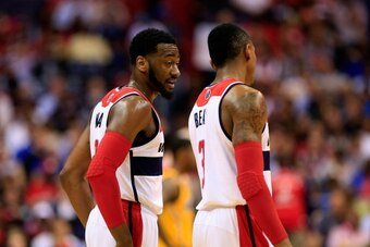 WASHINGTON, DC - MAY 09: John Wall #2 of the Washington Wizards talks with teammate Bradley Beal #3 during the first of half against the Indiana Pacers during Game 3 of the Eastern Conference Semifinals during the 2014 NBA Playoffs at Verizon Center on Ma