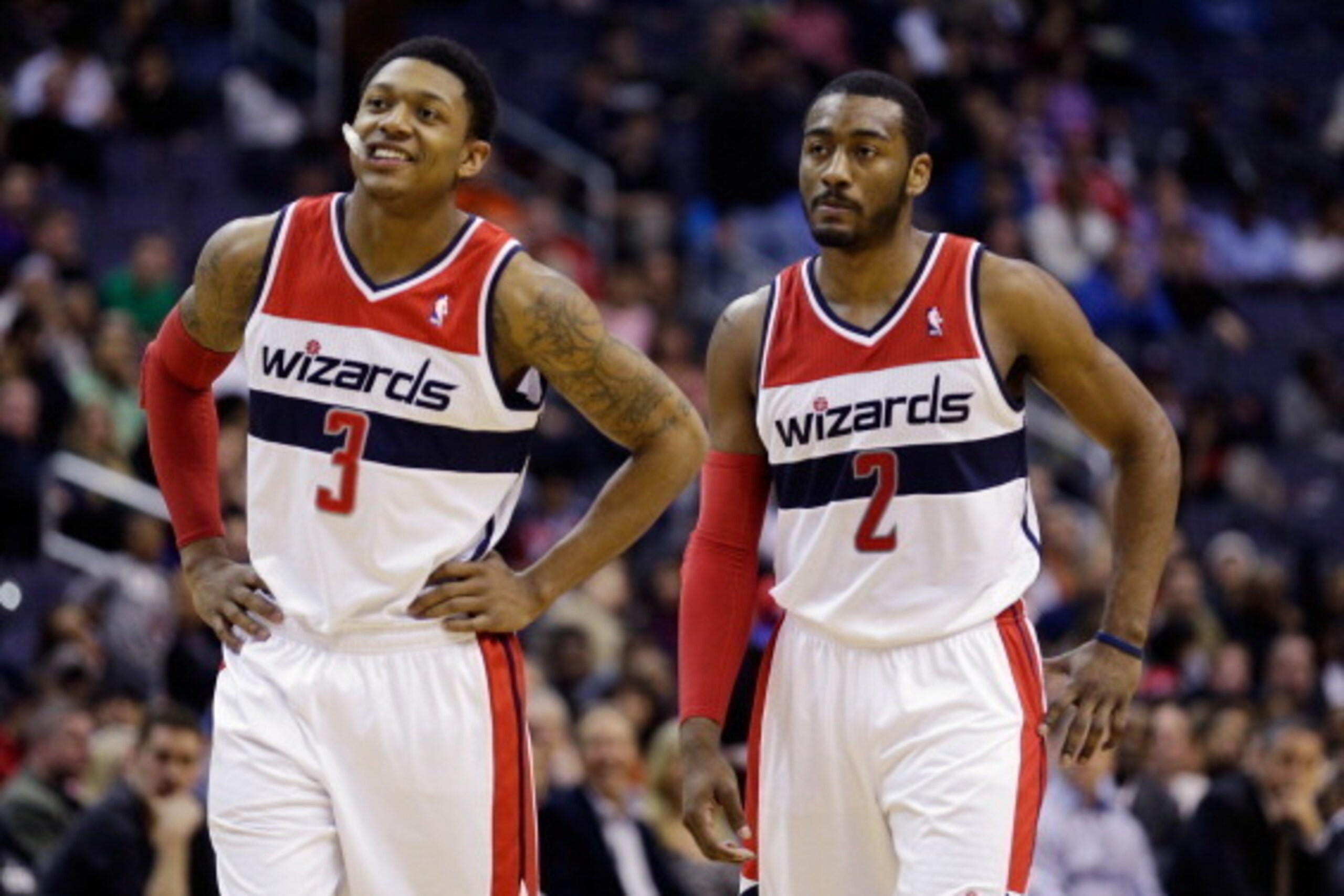 WASHINGTON, DC - MARCH 16: Bradley Beal #3 and and John Wall #2 of the Washington Wizards talk during a free throw in the first half against the Phoenix Suns at Verizon Center on March 16, 2013 in Washington, DC. NOTE TO USER: User expressly acknowledges 