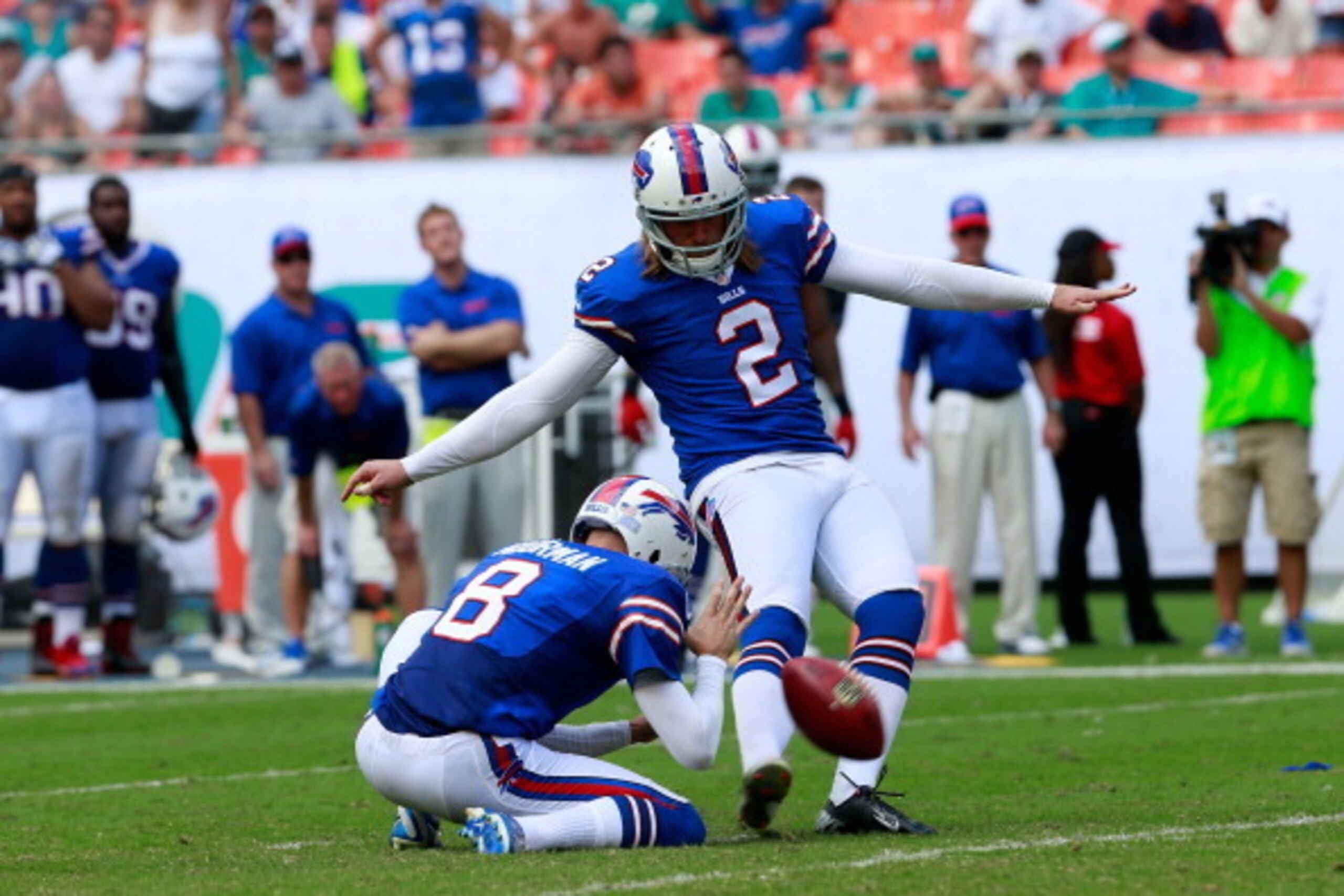 MIAMI GARDENS, FL - OCTOBER 20:  (R) Dan Carpenter of the Buffalo Bills kicks a fiels goal in the last minute as (L)  Brian Moorman #8 of the Buffalo Bills looks on against the Miami Dolphins at Sun Life Stadium on October 20, 2013 in Miami Gardens, Flori