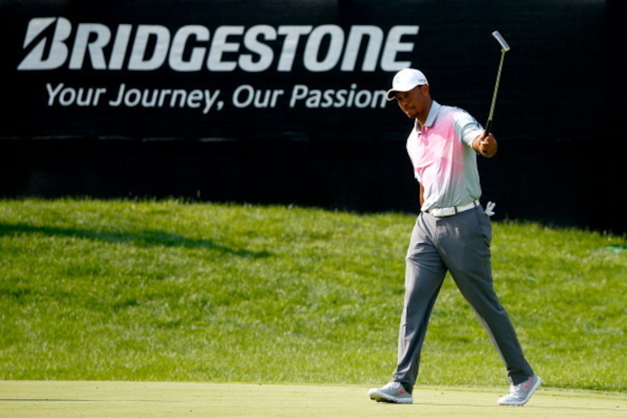 AKRON, OH - JULY 31:  Tiger Woods reacts to a birdie putt on the 16th green during the first round of the World Golf Championships-Bridgestone Invitational at Firestone Country Club South Course on July 31, 2014 in Akron, Ohio.  (Photo by Sam Greenwood/Ge