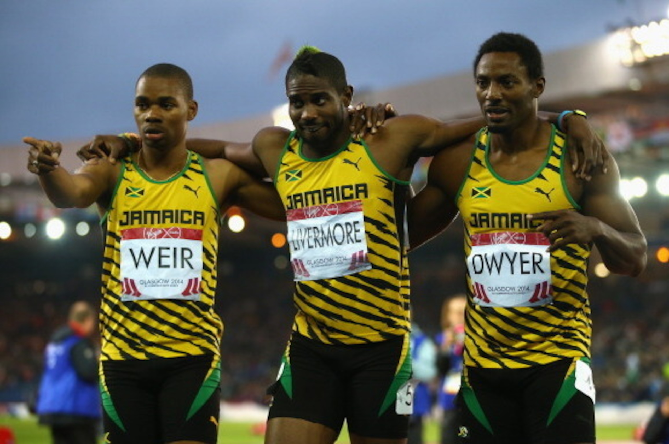 GLASGOW, SCOTLAND - JULY 31:  (L-R) Silver medalist Warren Weir of Jamaica,  Bronze medalist Jason Livermore of Jamaica and Gold medalist Rasheed Dwyer of Jamaica celebrate after the Men's 200 metres Final at Hampden Park during day eight of the Glasgow 2