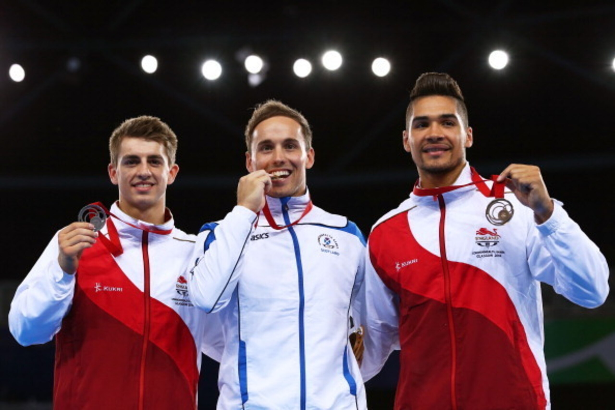 GLASGOW, SCOTLAND - JULY 31:  Gold medalist Daniel Keatings of Scotland poses with silver medalist Max Whitlock (L) of England and bronze medalist Louis Smith of England during the medal ceremony for the Men's Pommel Horse Final at SSE Hydro during day ei