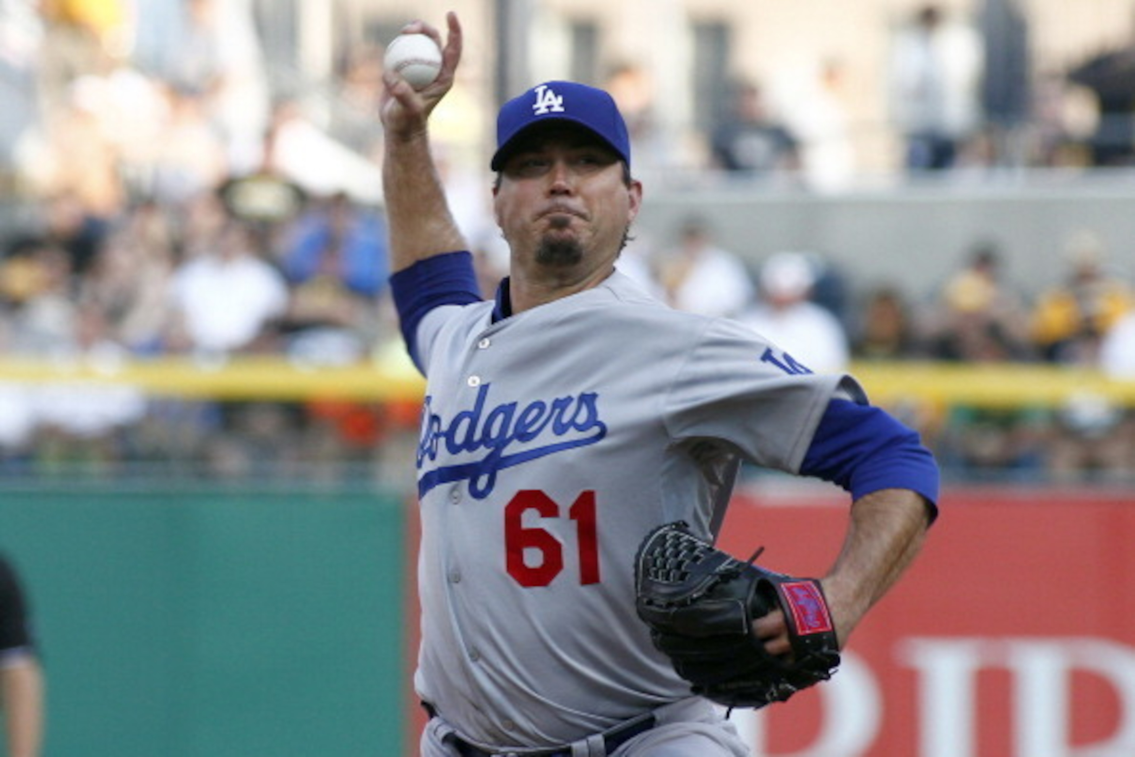 PITTSBURGH, PA - JULY 22:  Josh Beckett #61 of the Los Angeles Dodgers pitches in the first inning against the Pittsburgh Pirates during the game at PNC Park July 22, 2014 in Pittsburgh, Pennsylvania.  (Photo by Justin K. Aller/Getty Images)