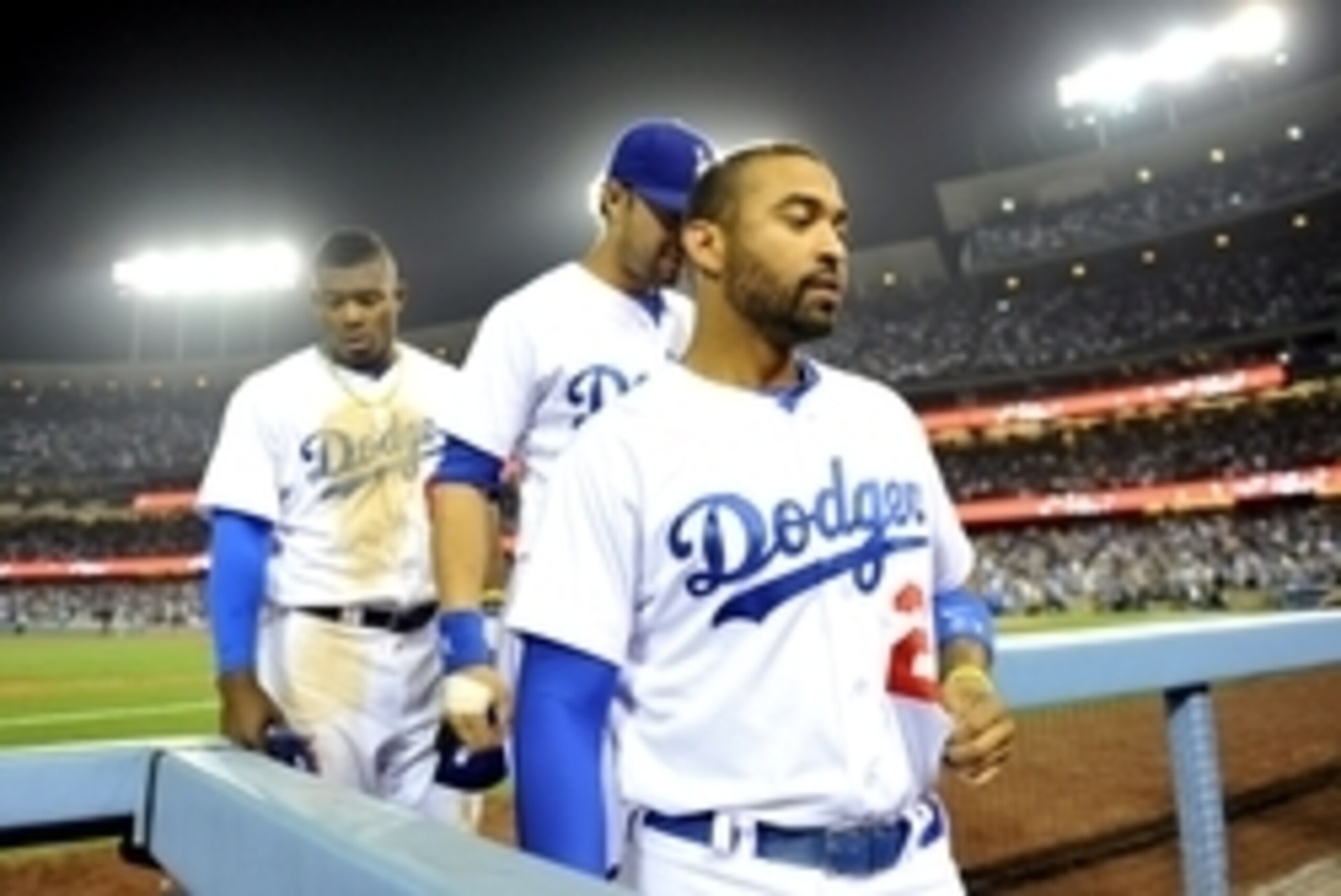 June 14, 2014; Los Angeles, CA, USA; Los Angeles Dodgers center fielder Matt Kemp (27), center fielder Andre Ethier (16) and right fielder Yasiel Puig (66) return to the dugout following the seventh inning against the Arizona Diamondbacks at Dodger Stadiu