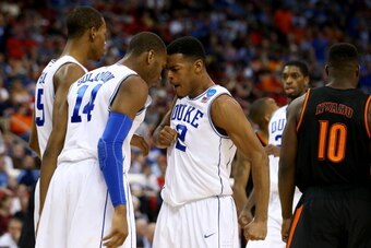 RALEIGH, NC - MARCH 21:  Quinn Cook #2, Rasheed Sulaimon #14 and Rodney Hood #5 of the Duke Blue Devils celebrate in the second half against the Mercer Bears in the second round of the 2014 NCAA Men's Basketball Tournament at PNC Arena on March 21, 2014 i