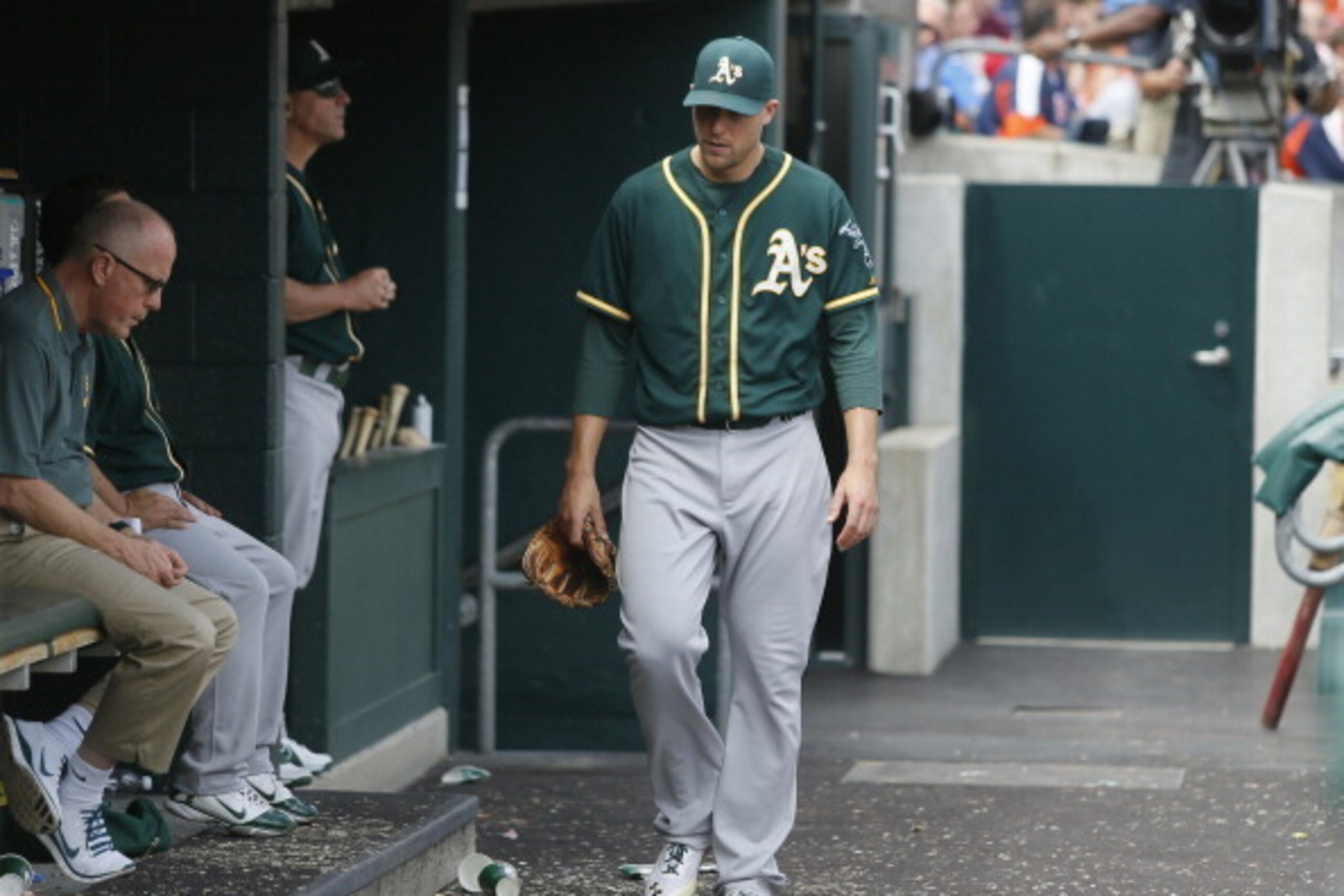 DETROIT, MI - JULY 2:  Jim Johnson #45 of the Oakland Athletics walks though the dugout after being pulled during the sixth inning of a game against the Detroit Tigers at Comerica Park on July 2, 2014 in Detroit, Michigan. Johnson gave up four runs on fou