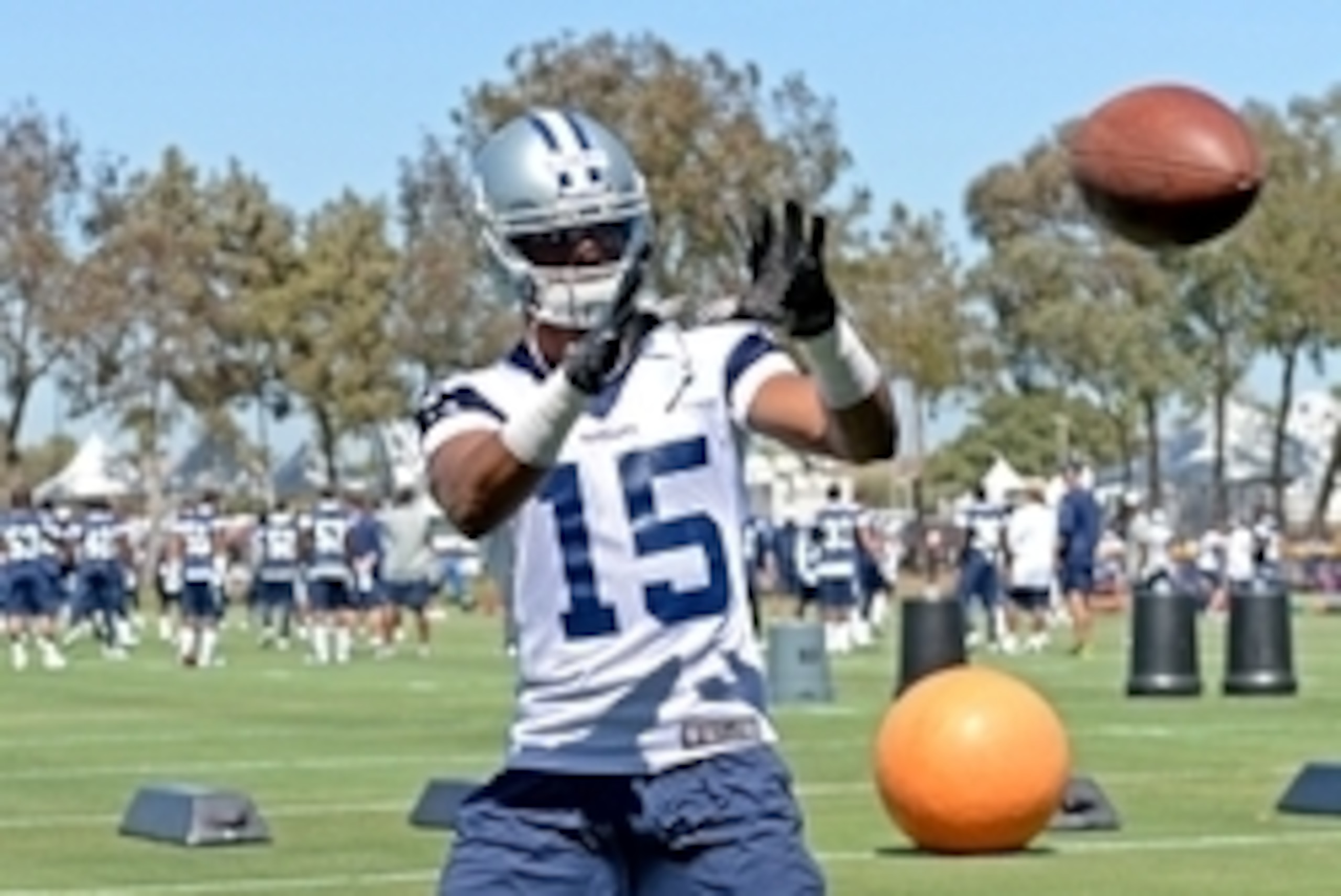 Jul 24, 2014; Oxnard, CA, USA; Dallas Cowboys wide receiver Devin Street (15) catches some balls to warm up before starting training camp at the River Ridge Playing Fields.  Mandatory Credit: Jayne Kamin-Oncea-USA TODAY Sports