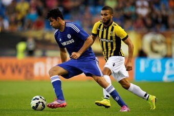 ARNHEM, NETHERLANDS - JULY 30:  Diego Costa of Chelsea gets past Zakaria Labyad of Vitesse during the pre season friendly match between Vitesse Arnhem and Chelsea at the Gelredome Stadium on July 30, 2014 in Arnhem, Netherlands.  (Photo by Dean Mouhtaropo