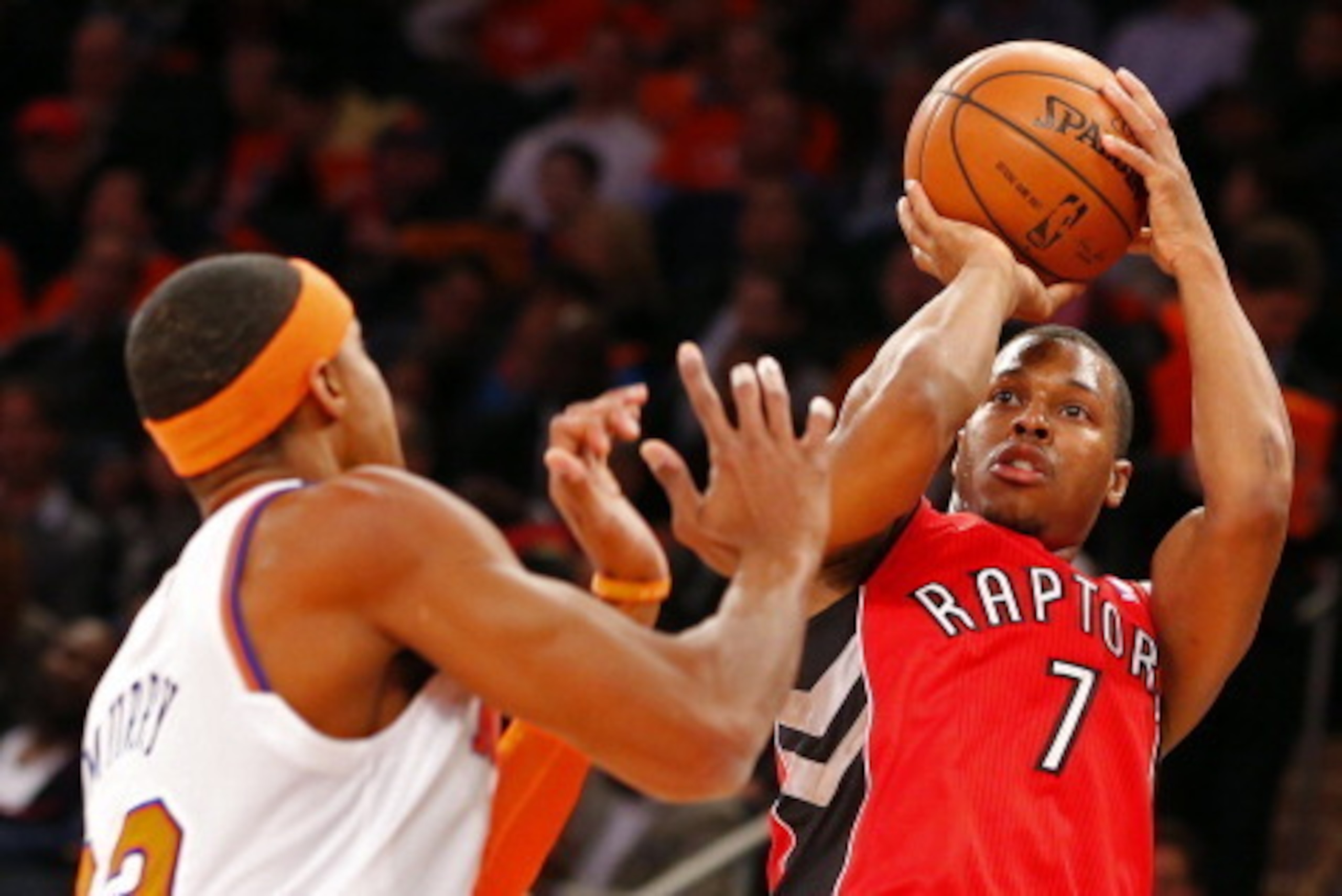 NEW YORK, NY - APRIL 16: Kyle Lowry #7 of the Toronto Raptors takes a shot as Toure Murry #23 of the New York Knicks defends in the first half during an NBA basketball game at Madison Square Garden on April. 16, 2014 in New York City. NOTE TO USER: User e