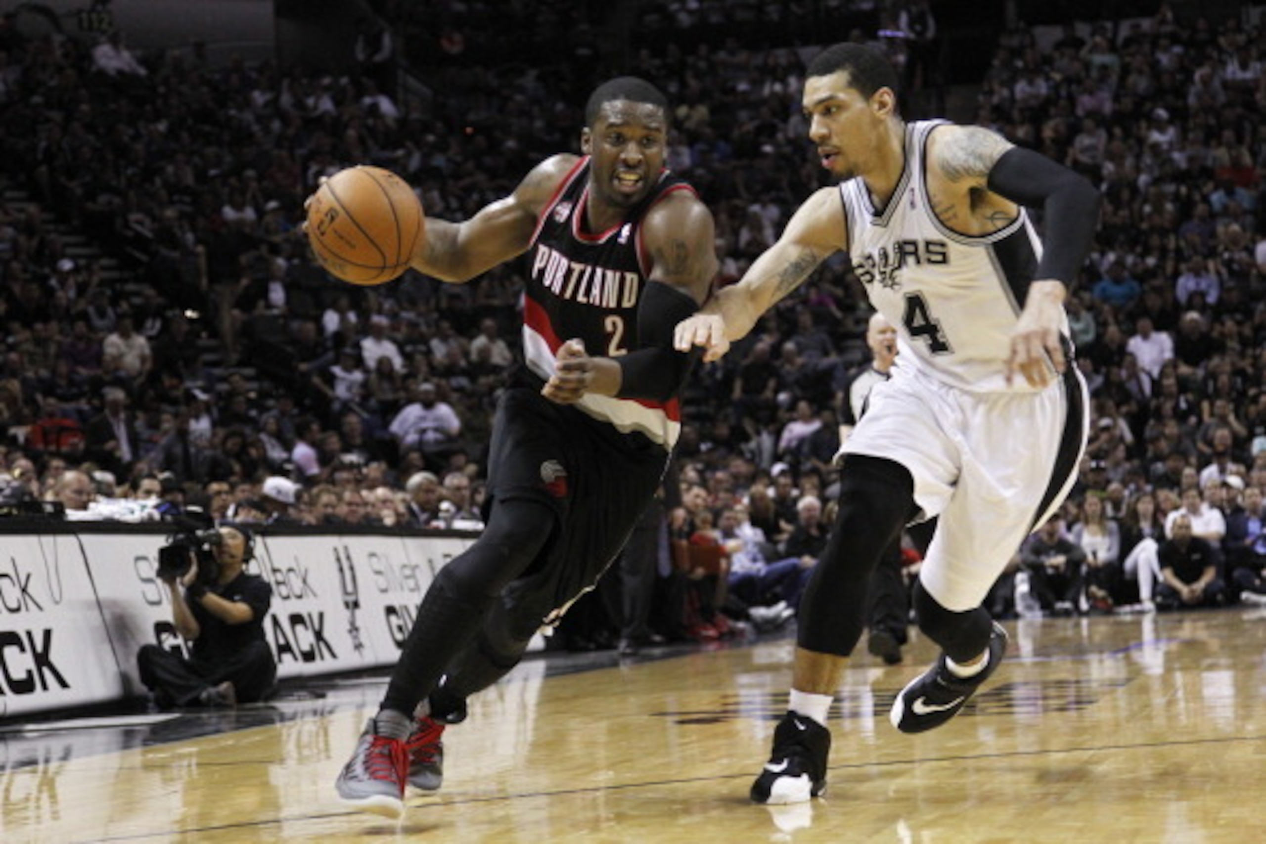 SAN ANTONIO, TX - MAY 8: Wesley Matthews #2 of the Portland Trail Blazers drives around Danny Green #4 of the San Antonio Spurs in Game Two of the Western Conference Semifinals during the 2014 NBA Playoffs at the AT&T Center on May 8, 2014 in San Antonio SAN ANTONIO, TX - MAY 8: Wesley Matthews #2 of the Portland Trail Blazers drives around Danny Green #4 of the San Antonio Spurs in Game Two of the Western Conference Semifinals during the 2014 NBA Playoffs at the AT&T Center on May 8, 2014 in San Antonio