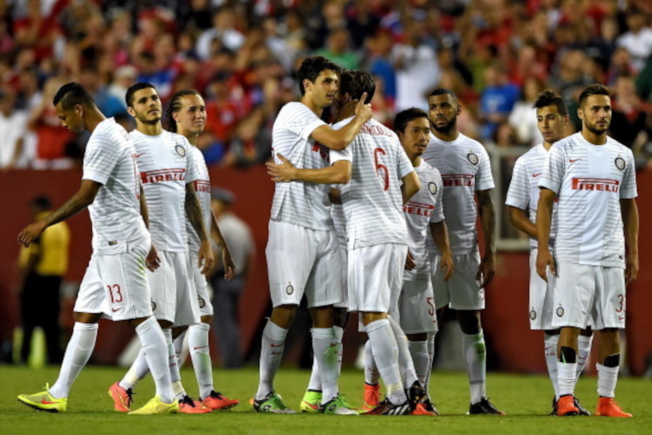 LANDOVER, MD - JULY 29: Marco Andreolli #6 of Inter Milan is met by his teammates after missing a shot in penalty shootouts against Manchester United during their match in the International Champions Cup 2014 at FedExField on July 29, 2014 in Landover, Ma