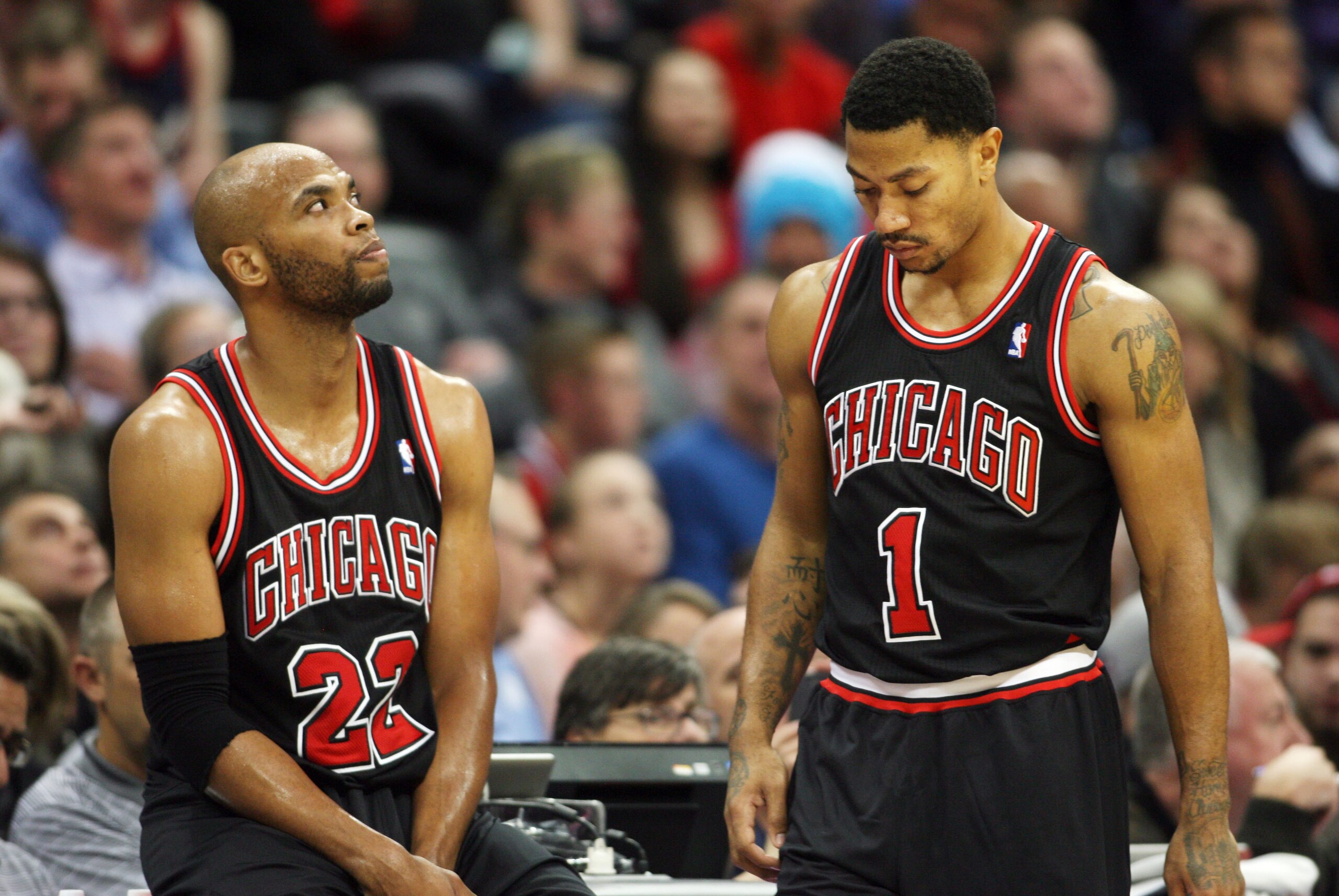 Nov 21, 2013; Denver, CO, USA; Chicago Bulls guard Derrick Rose (1) and forward Taj Gibson (22) during the second half against the Denver Nuggets at Pepsi Center. The Nuggets won 97-87. Mandatory Credit: Chris Humphreys-USA TODAY Sports