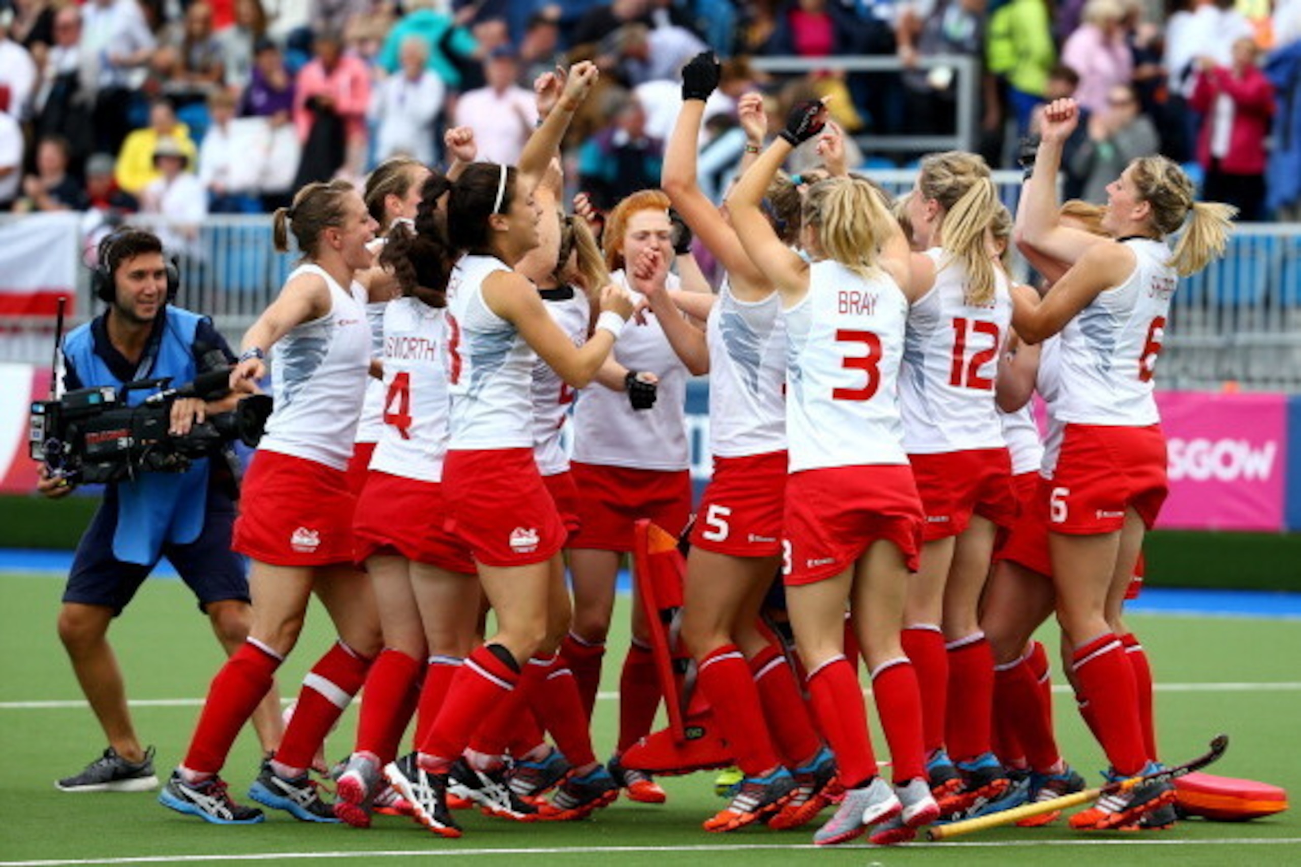 GLASGOW, SCOTLAND - AUGUST 01:  The England players celebrate as goal keeper Maddie Hinch saves the deciding penalty shuttle to put England through to the Gold Medal final during the Women's Hockey Semi Final between New Zealand and England at Glasgow Nat
