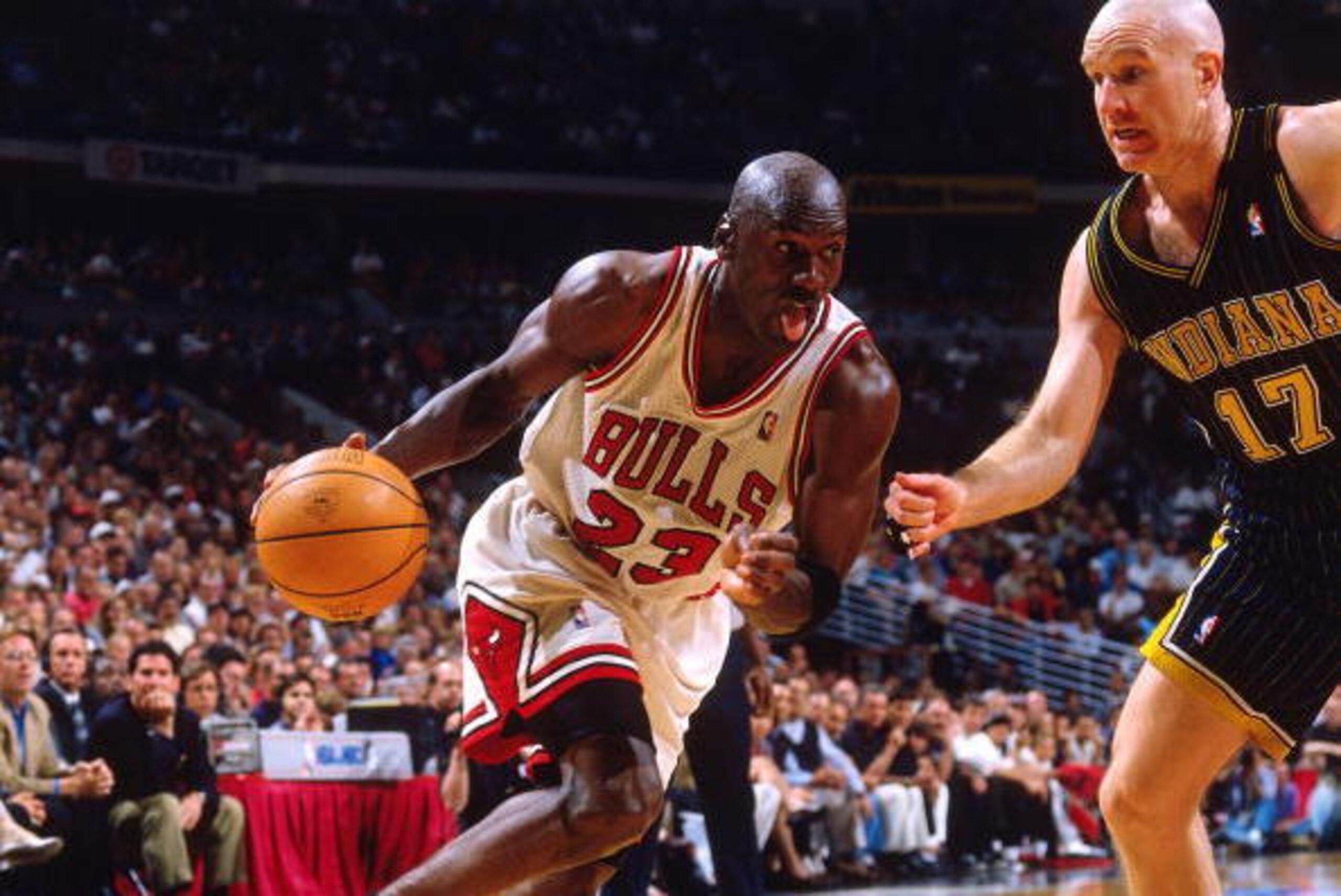 CHICAGO - MAY 31:  Michael Jordan #23 of the Chicago Bulls drives to the basket against Chris Mullin #17 of the Indiana Pacers in Game Seven of the Eastern Conference Finals during the 1998 NBA Playoffs at the United Center on May 31, 1998 in Chicago. The