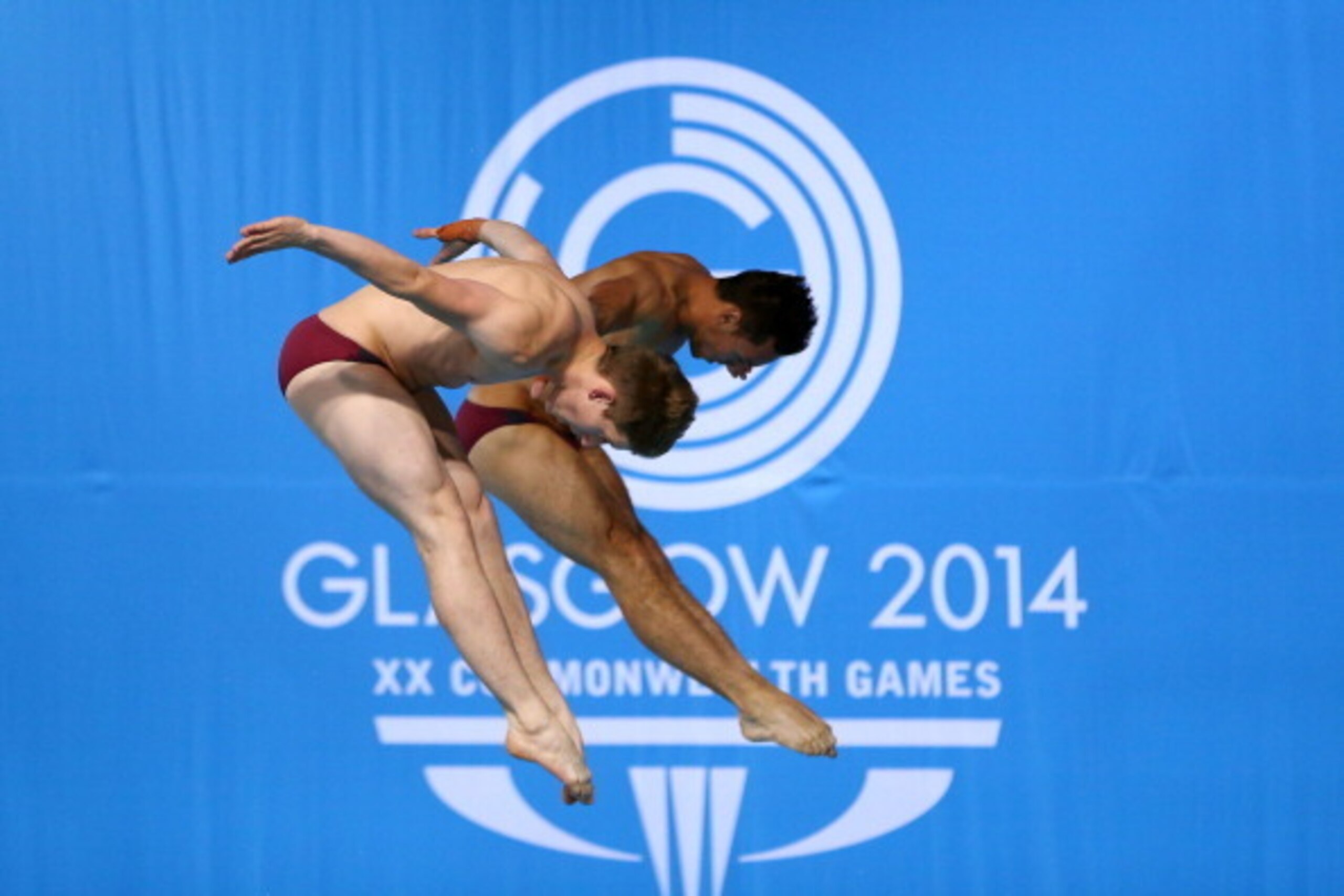 EDINBURGH, SCOTLAND - AUGUST 01:  Tom Daley and Denny James of England compete in the Men's Synchronised 10m Platform Final at Royal Commonwealth Pool during day nine of the Glasgow 2014 Commonwealth Games on August 1, 2014 in Edinburgh, Scotland.  (Photo