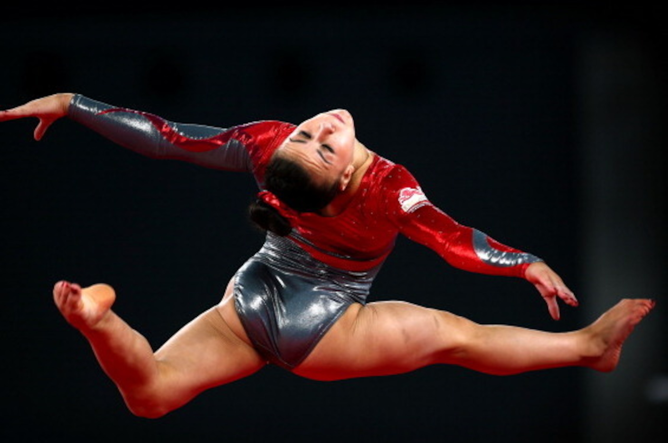 GLASGOW, SCOTLAND - AUGUST 01:  Gold medalist Claudia Fragapane of England competes during the Women's Floor Final at SSE Hydro during day nine of the Glasgow 2014 Commonwealth Games on August 1, 2014 in Glasgow, Scotland.  (Photo by Julian Finney/Getty I