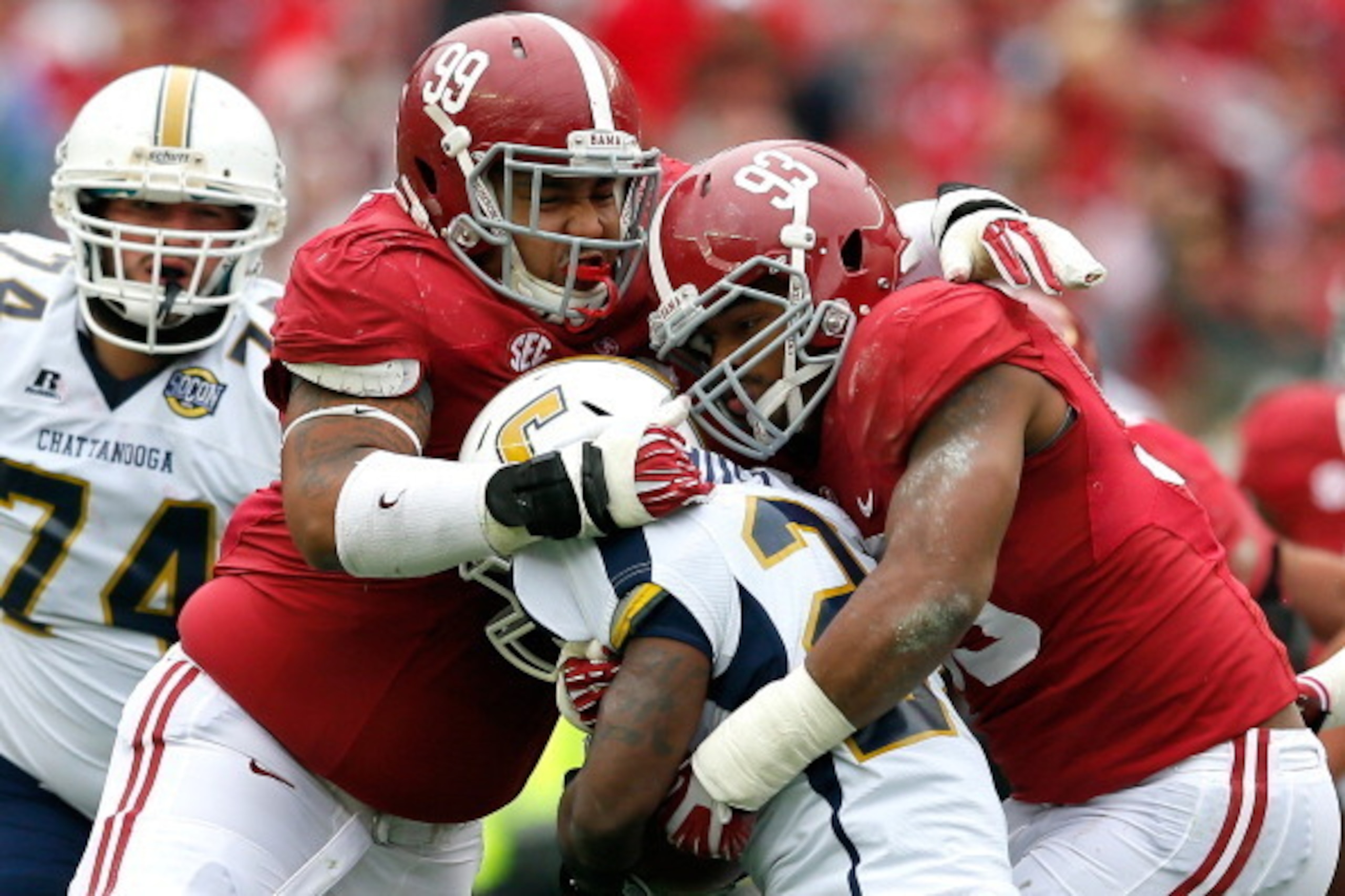 TUSCALOOSA, AL - NOVEMBER 23:  Brandon Ivory #99 and Jonathan Allen #93 of the Alabama Crimson Tide tackle Kendrix Huitt #27 of the Chattanooga Mocs at Bryant-Denny Stadium on November 23, 2013 in Tuscaloosa, Alabama.  (Photo by Kevin C. Cox/Getty Images)