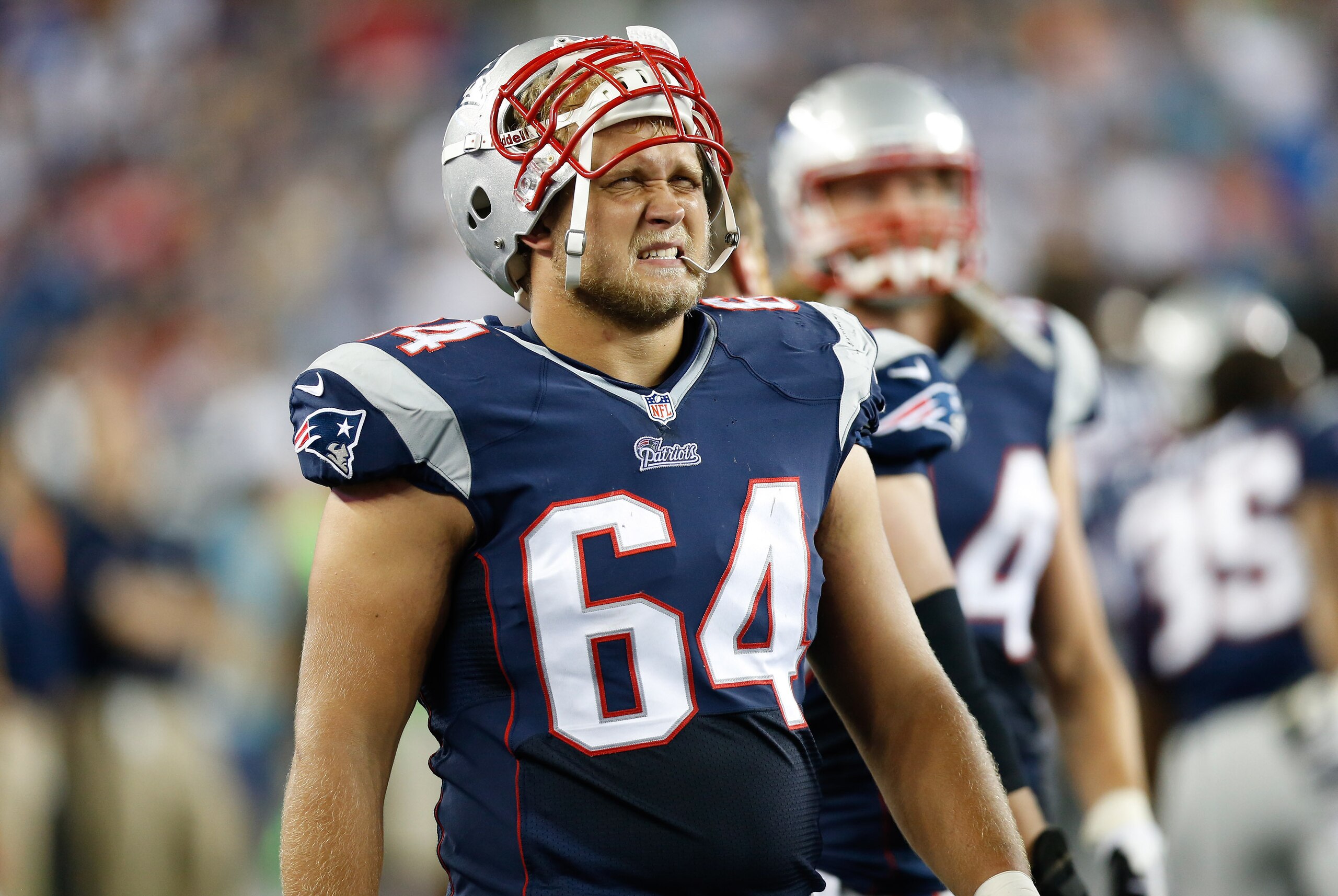 Aug 16, 2013; Foxborough, MA, USA; New England Patriots defensive tackle Joe Vellano (64) on the sideline during the third quarter against the Tampa Bay Buccaneers at Gillette Stadium.  The New England Patriots won 25-21.  Mandatory Credit: Greg M. Cooper