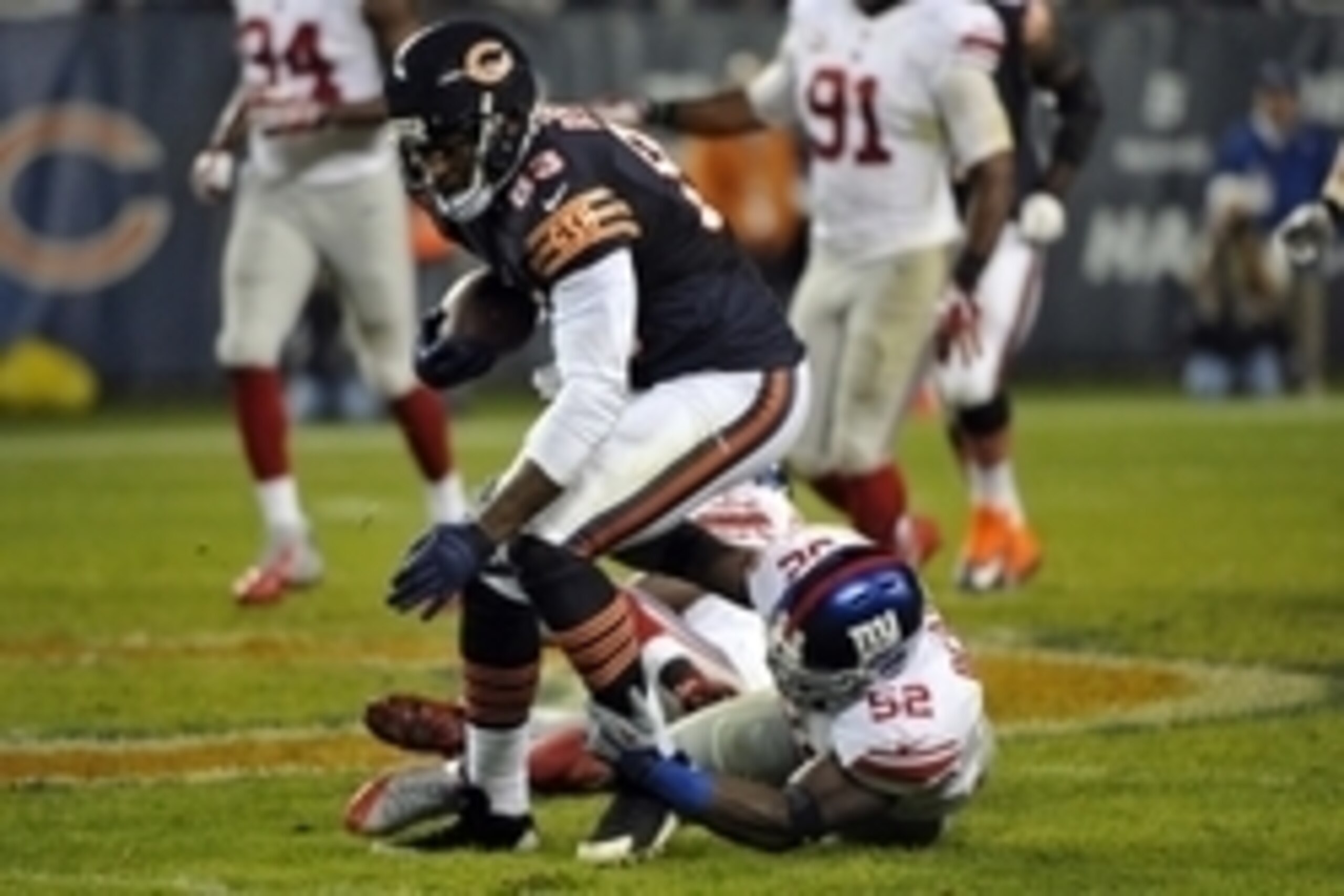 Oct 10, 2013; Chicago, IL, USA; Chicago Bears tight end Martellus Bennett (83) runs the ball against New York Giants outside linebacker Jon Beason (52) during the second half at Soldier Field. The Bears beat the Giants 27-21. Mandatory Credit: Rob Grabow Oct 10, 2013; Chicago, IL, USA; Chicago Bears tight end Martellus Bennett (83) runs the ball against New York Giants outside linebacker Jon Beason (52) during the second half at Soldier Field. The Bears beat the Giants 27-21. Mandatory Credit: Rob Grabow