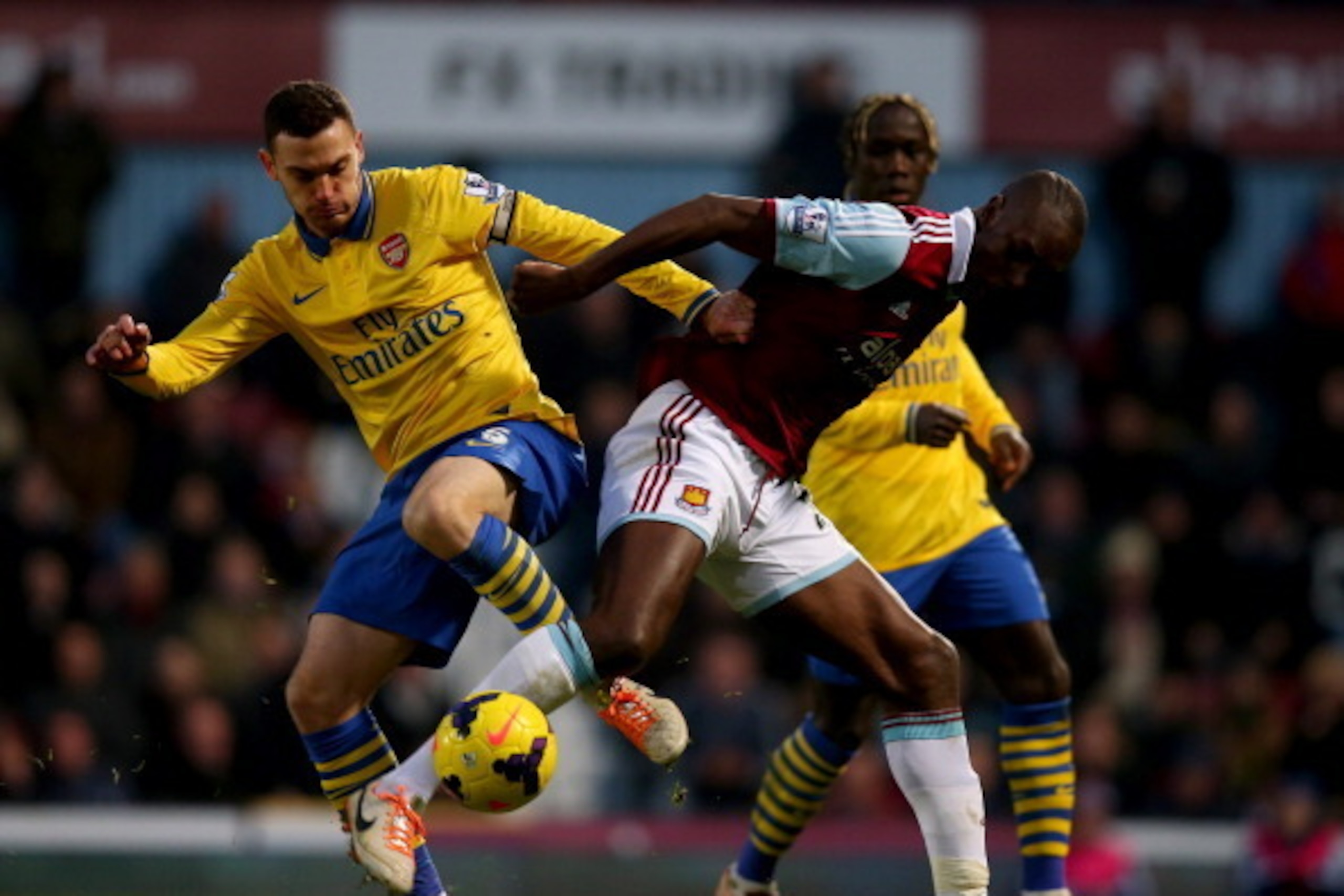 LONDON, ENGLAND - DECEMBER 26:  Thomas Vermaelen of Arsenal battles with Carlton Cole of West Ham United during the Barclays Premier League match between West Ham United and Arsenal at Boleyn Ground on December 26, 2013 in London, England.  (Photo by Bryn
