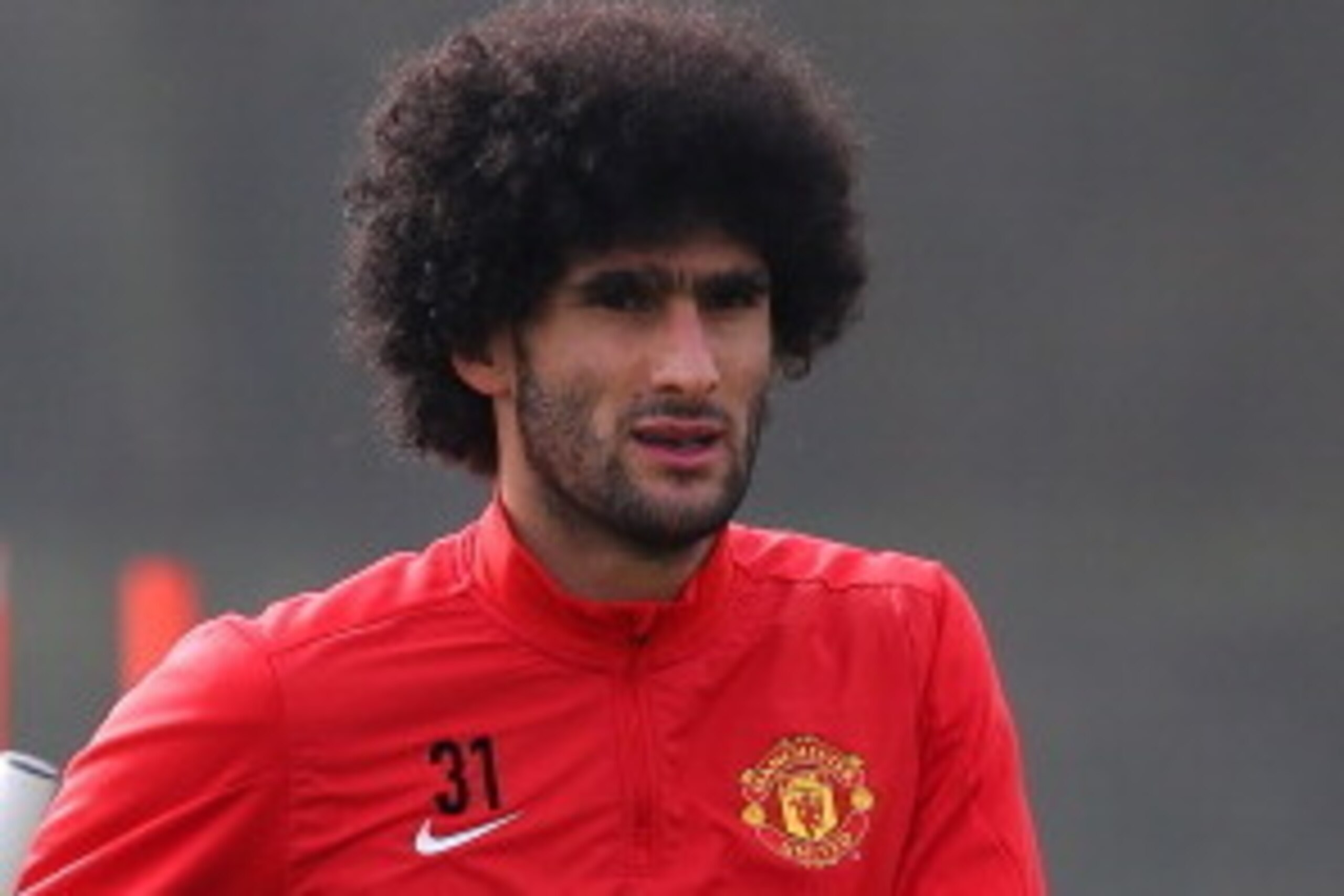 MANCHESTER, ENGLAND - MARCH 31:  Marouane Fellaini of Manchester United looks on during a training session at the Aon Training Complex on March 31, 2014 in Manchester, England.  (Photo by Alex Livesey/Getty Images)